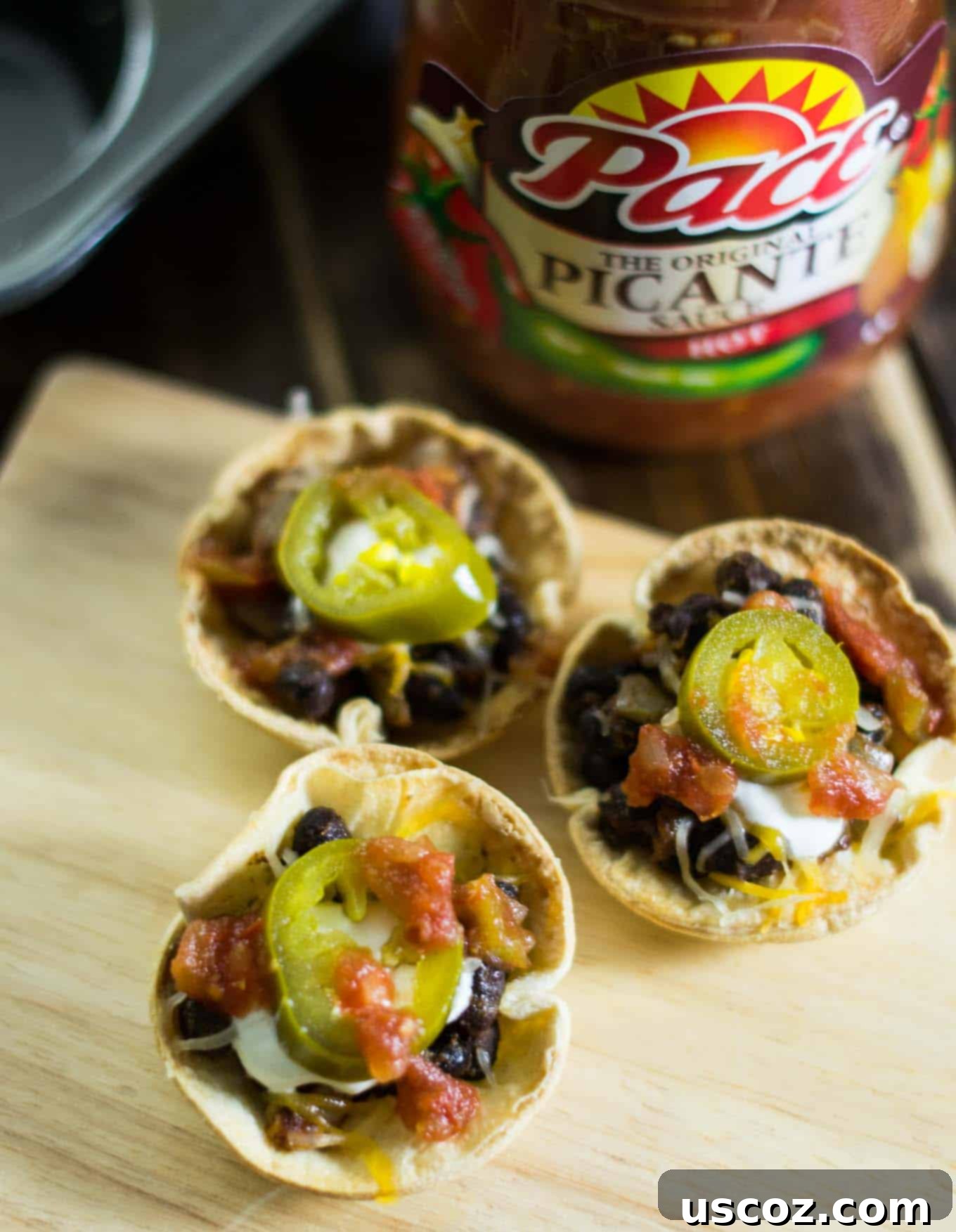 Plant-Powered Mexican Feasts 20 Vegetarian taco cups in a muffin tin, filled with colorful ingredients
