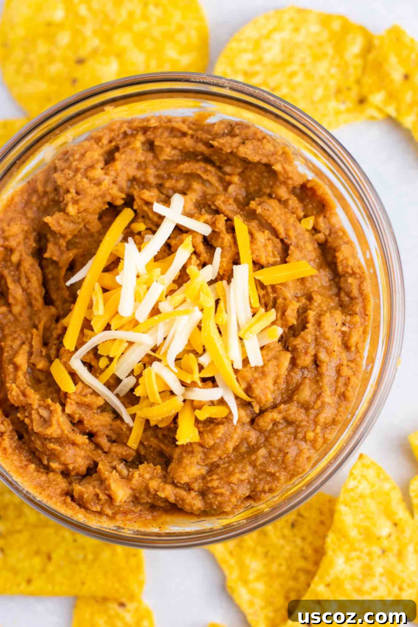 Plant-Powered Mexican Feasts 3 Close-up of freshly made 5-minute homemade refried beans in a bowl, showing their creamy texture