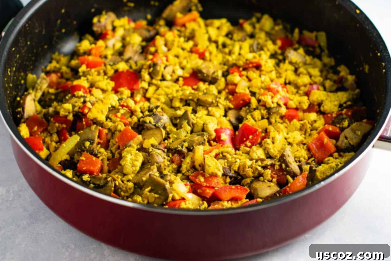 Wholesome Tofu Scramble 9 A generous serving of vegan tofu scramble, ready to be enjoyed as a hearty and healthy breakfast. #tofuscramble #vegan #breakfast #veganbreakfast #meatless #dairyfree #eggfree