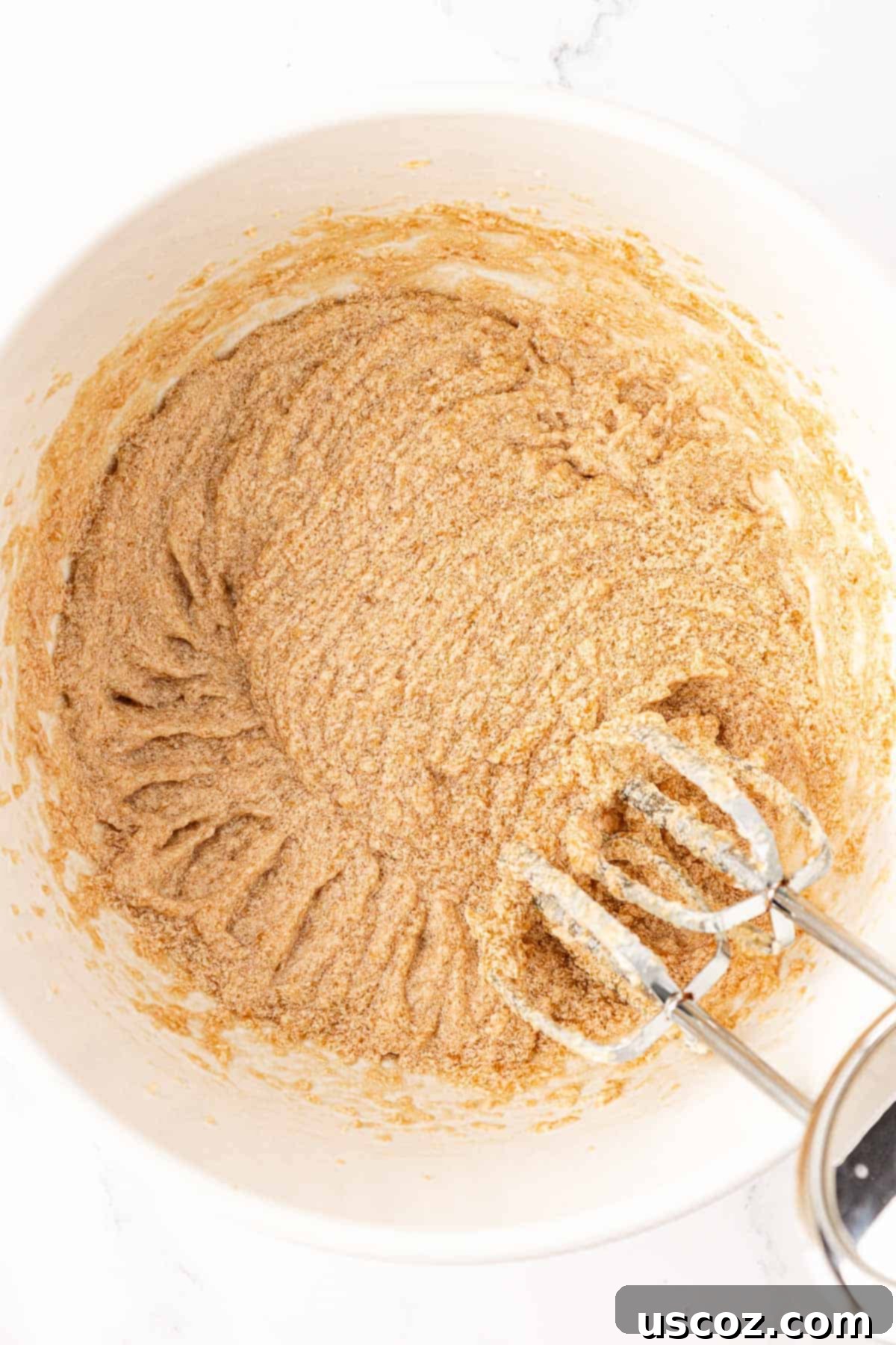 Delicious Vegan Chocolate Chip Cookies 8 wet ingredients fully mixed together in a bowl, appearing creamy and light