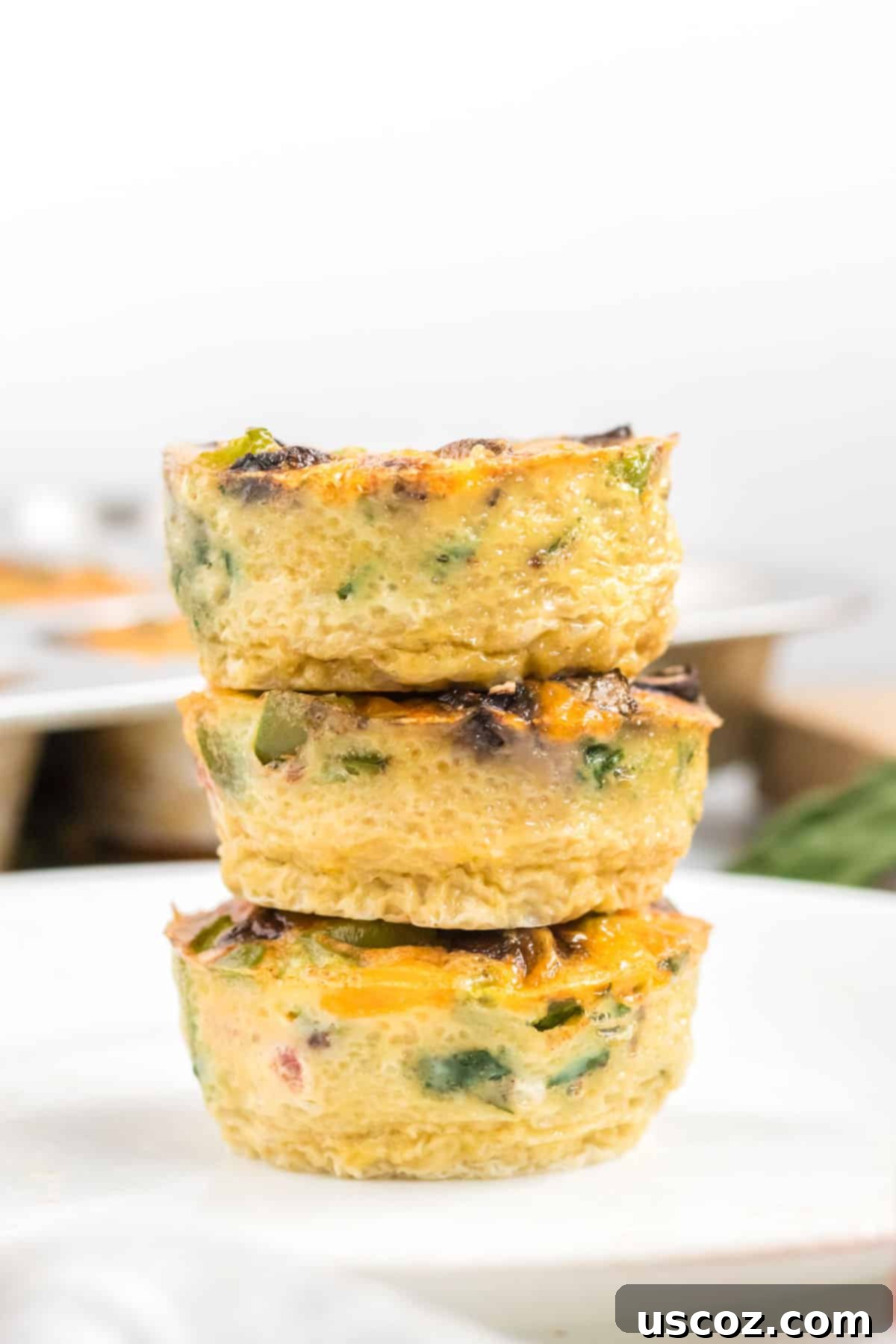 Savory Egg Muffins 11 A vibrant stack of freshly made egg muffins, perfect for a healthy and quick breakfast.