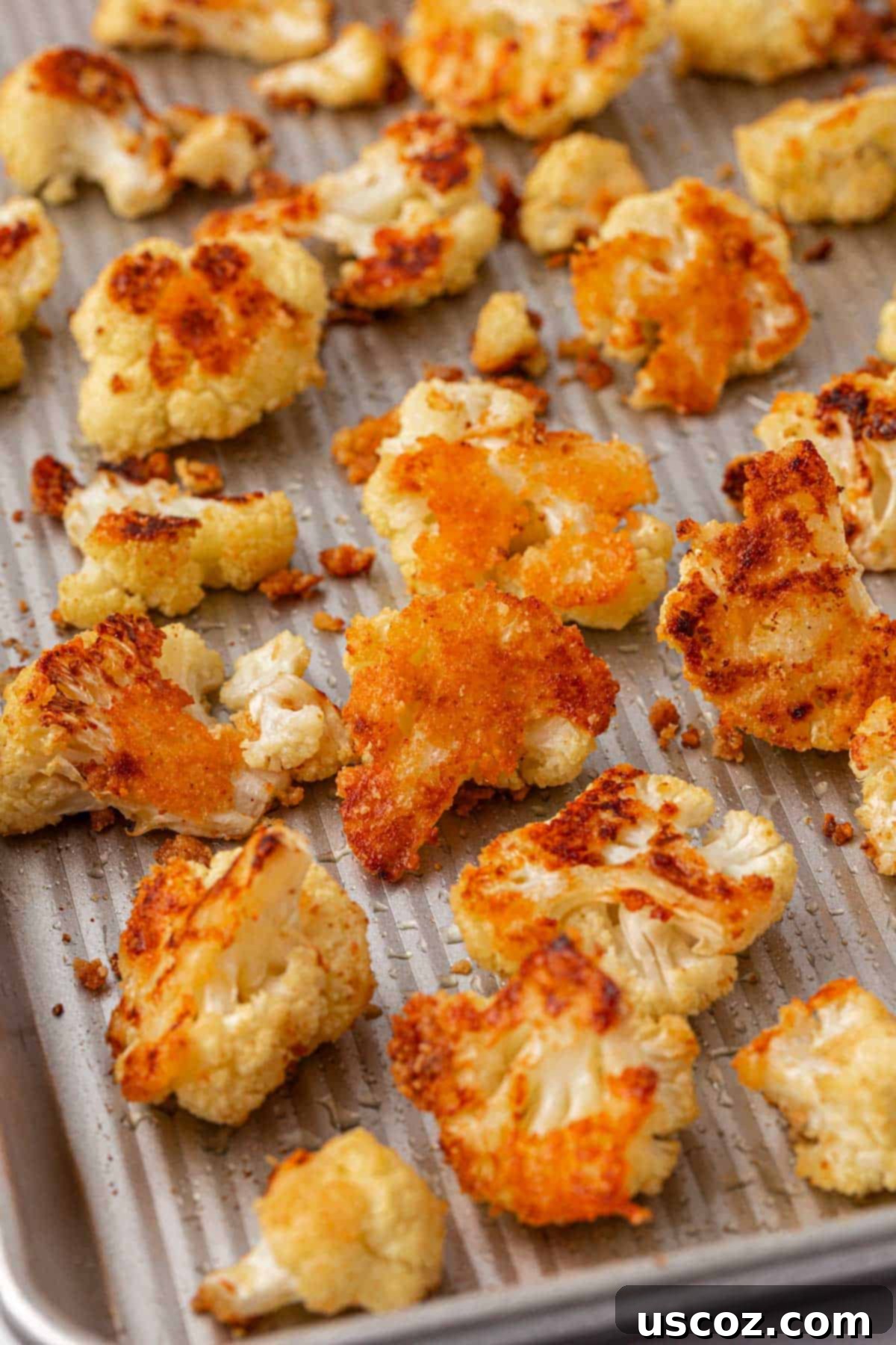 Crispy Parmesan Roasted Cauliflower 11 parmesan roasted cauliflower on a baking sheet