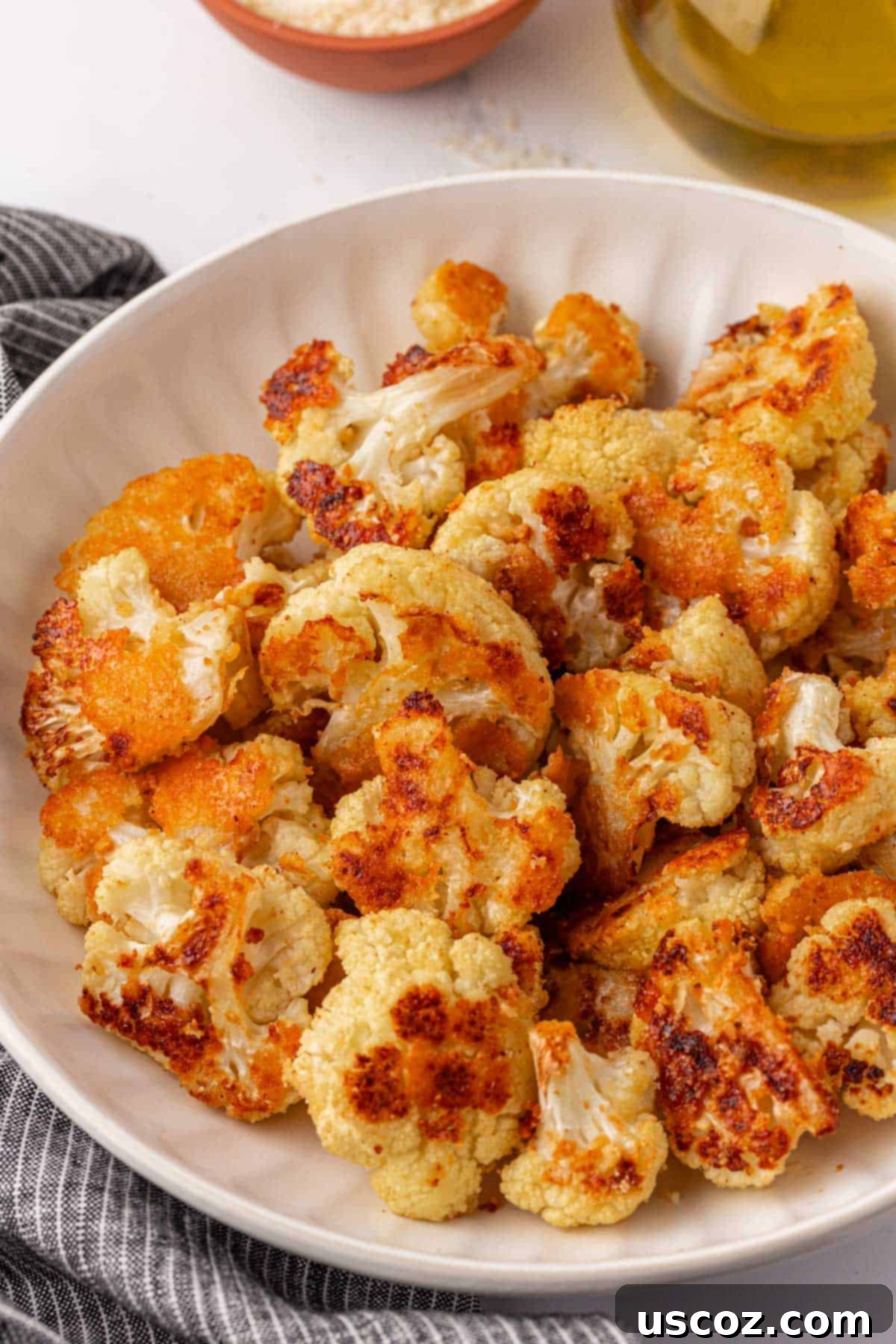 Crispy Parmesan Roasted Cauliflower 3 parmesan roasted cauliflower in a bowl