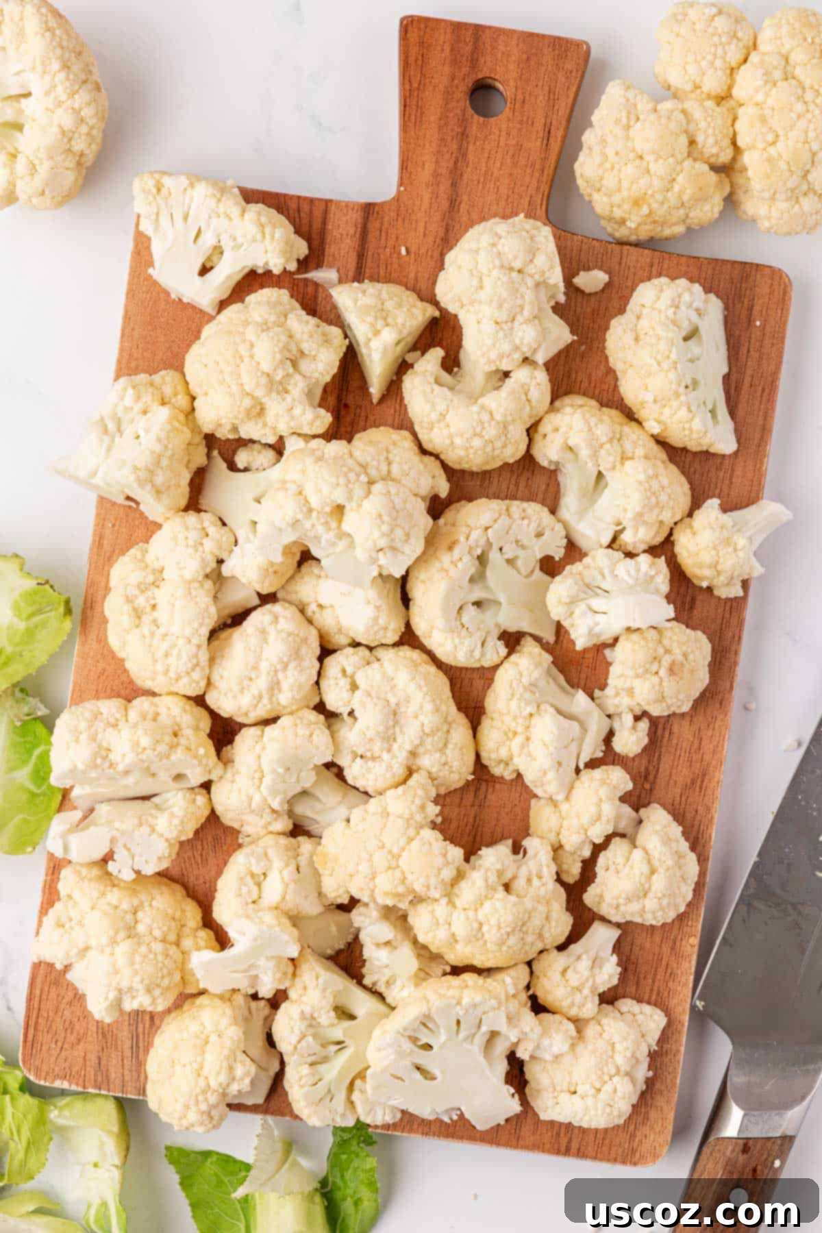 Crispy Parmesan Roasted Cauliflower 5 cauliflower florets on a cutting board