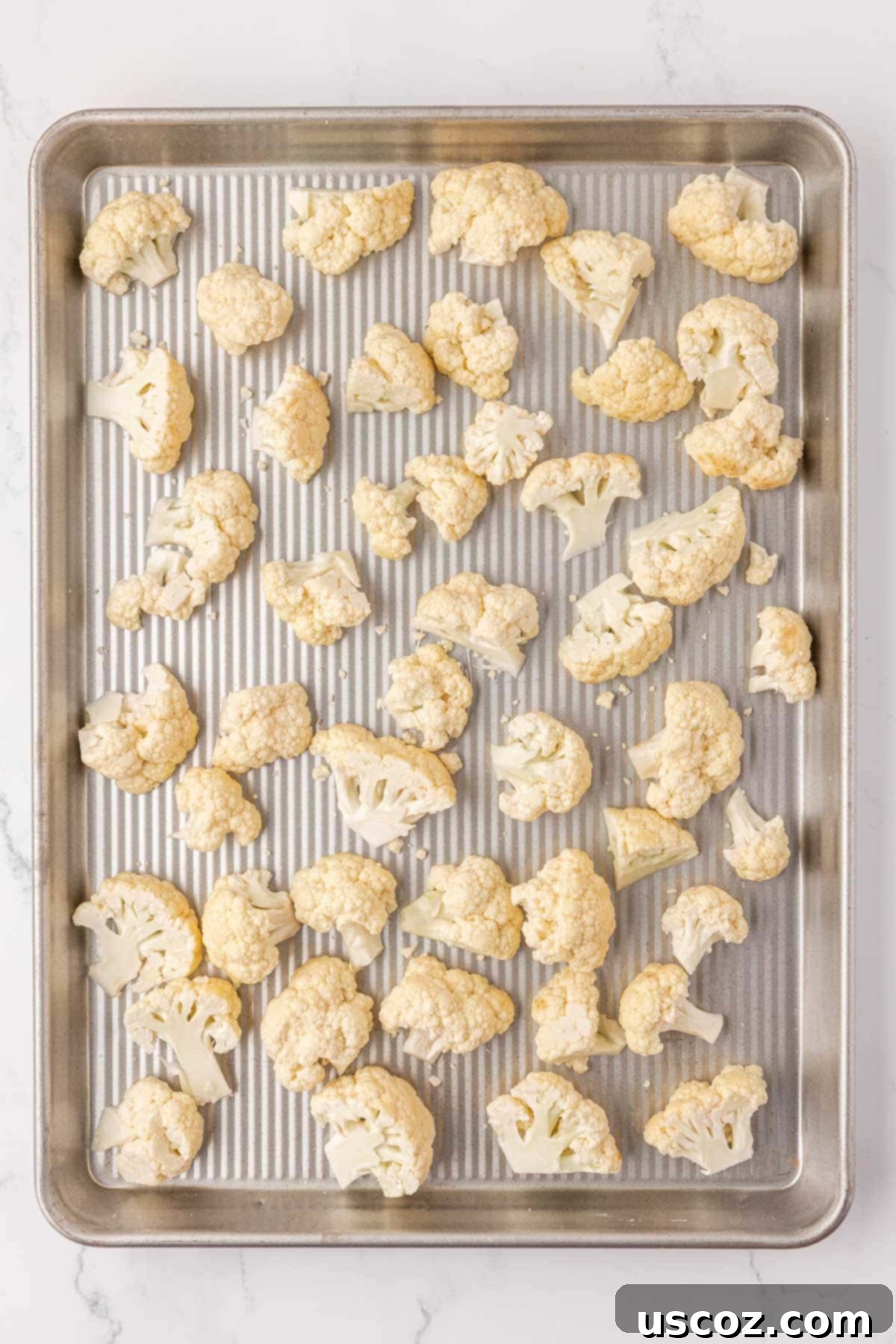 Crispy Parmesan Roasted Cauliflower 6 cauliflower florets on a baking sheet