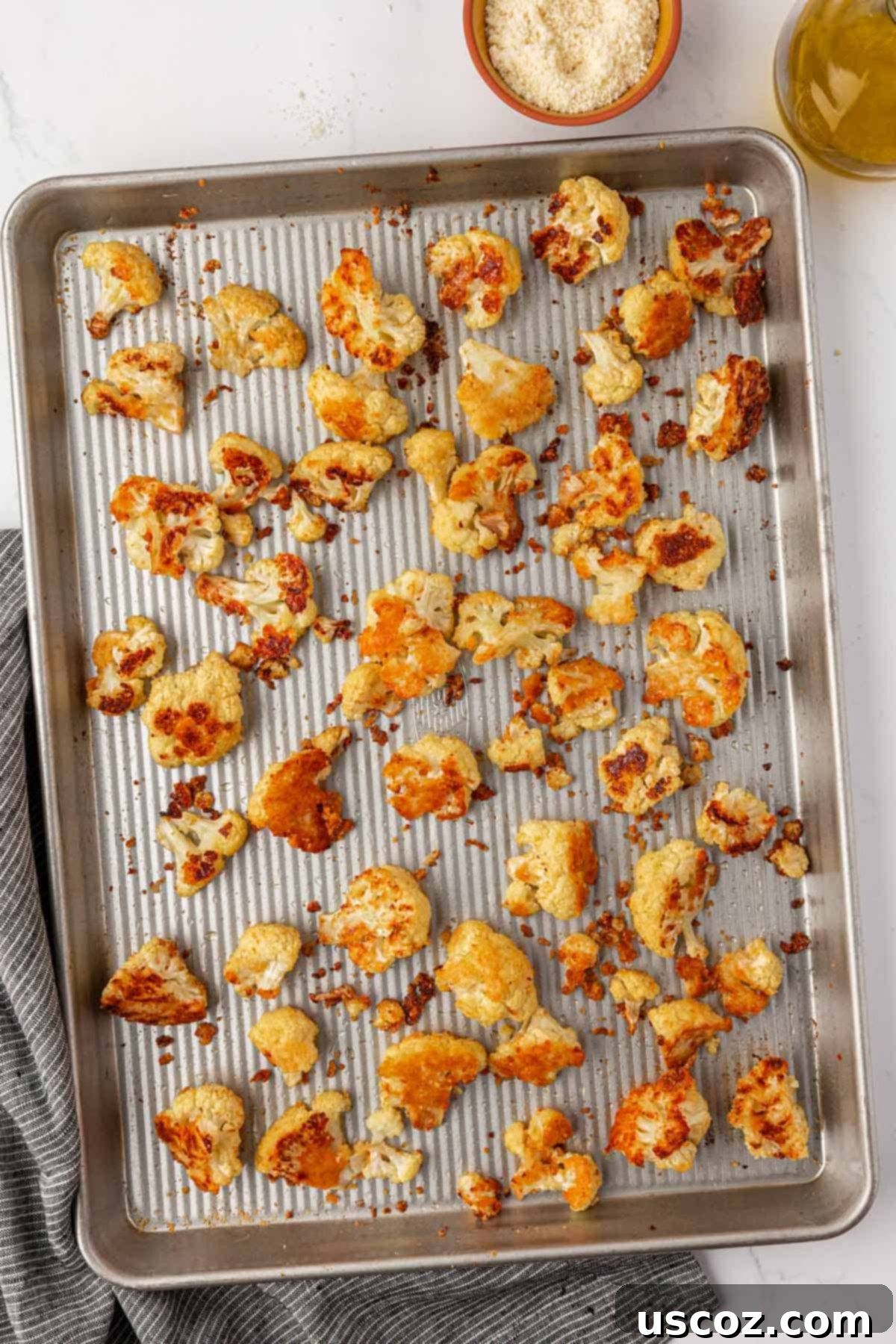 Crispy Parmesan Roasted Cauliflower 9 parmesan roasted cauliflower on a baking sheet