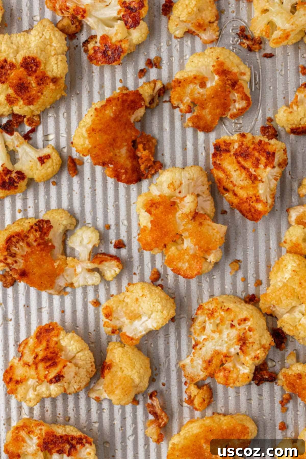 Crispy Parmesan Roasted Cauliflower 10 parmesan roasted cauliflower on a baking sheet
