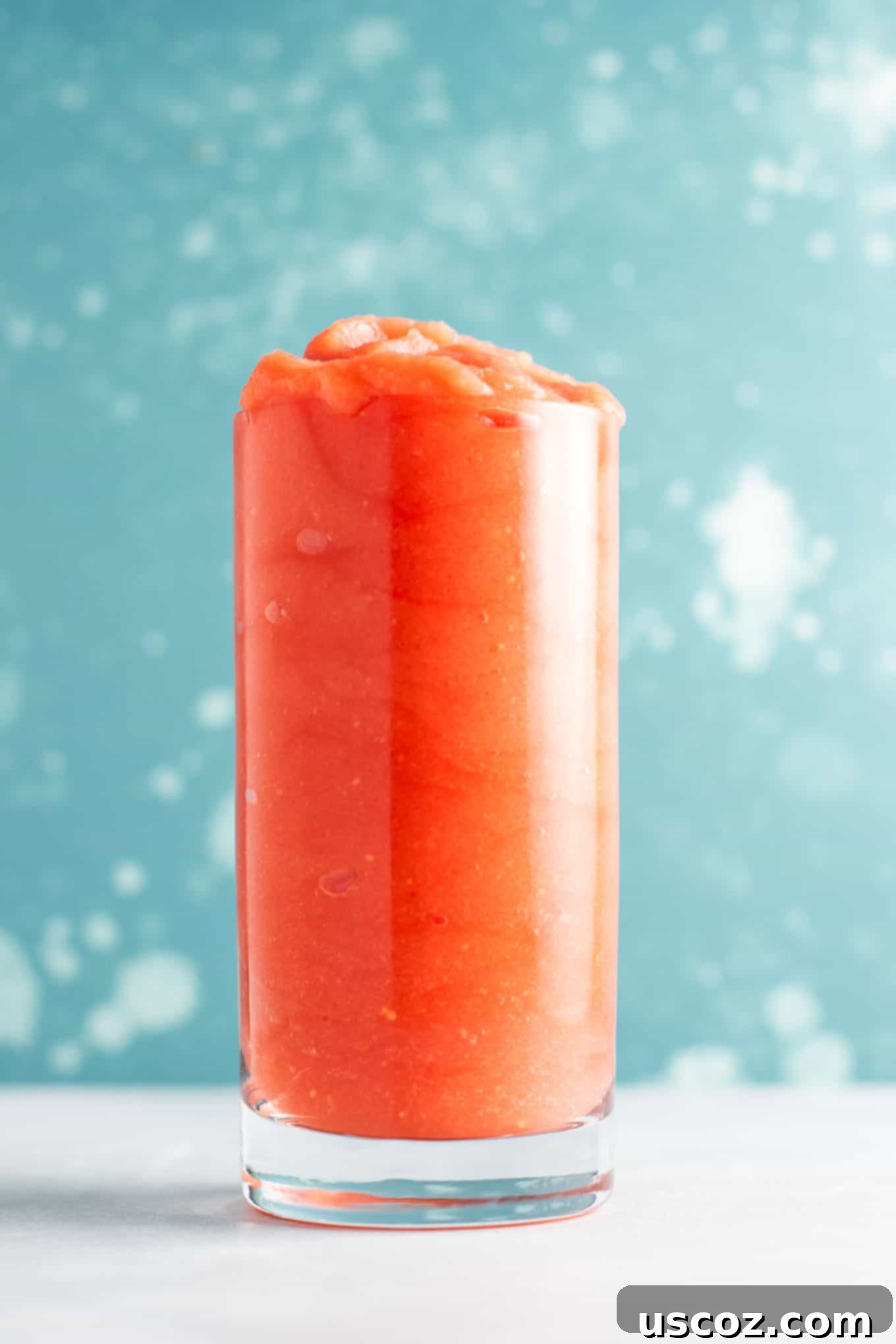 Ingredients for tropical gin slushies laid out: watermelon, mango, peaches, gin