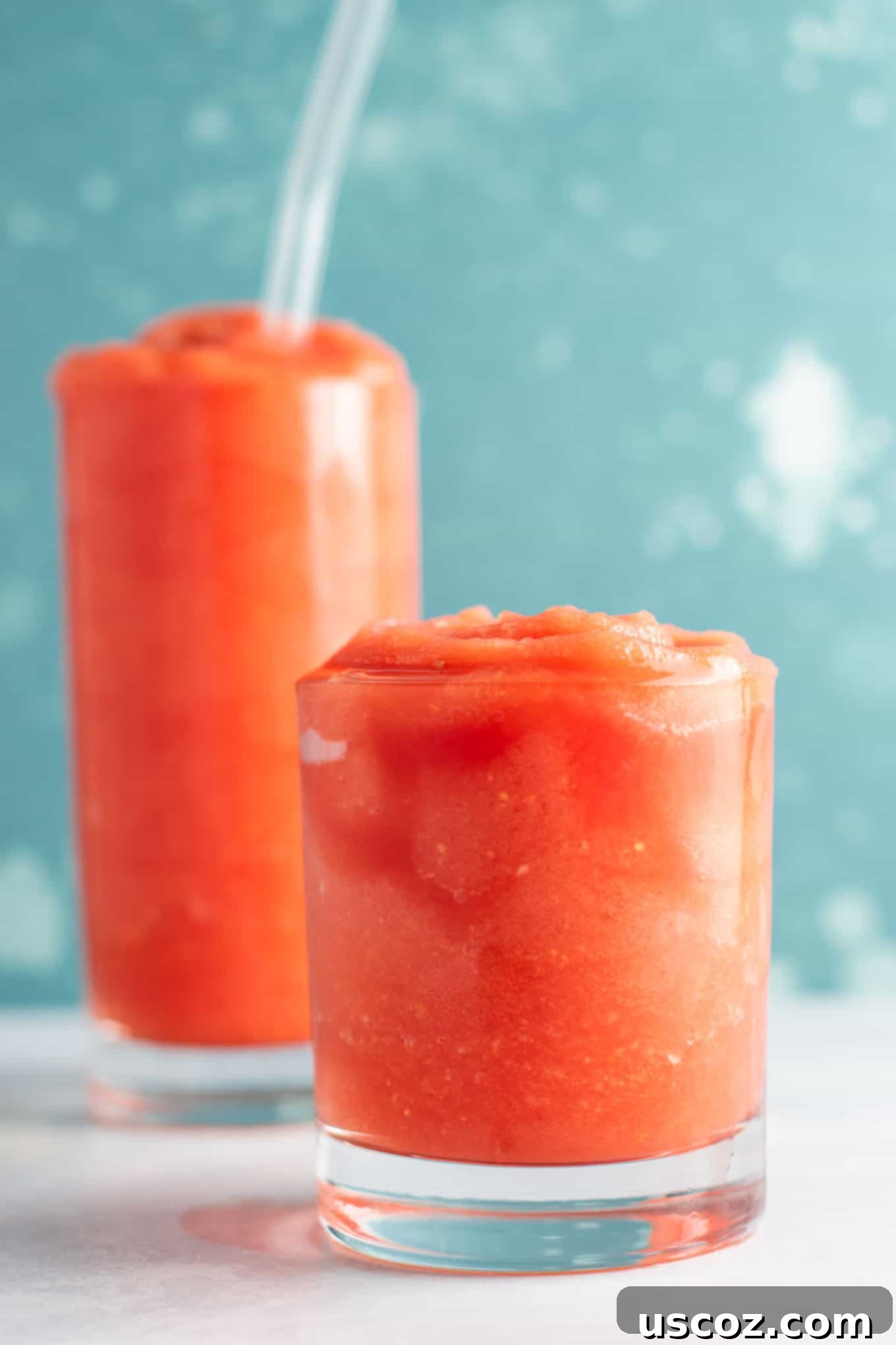 Overhead view of two sparkling watermelon gin slushies
