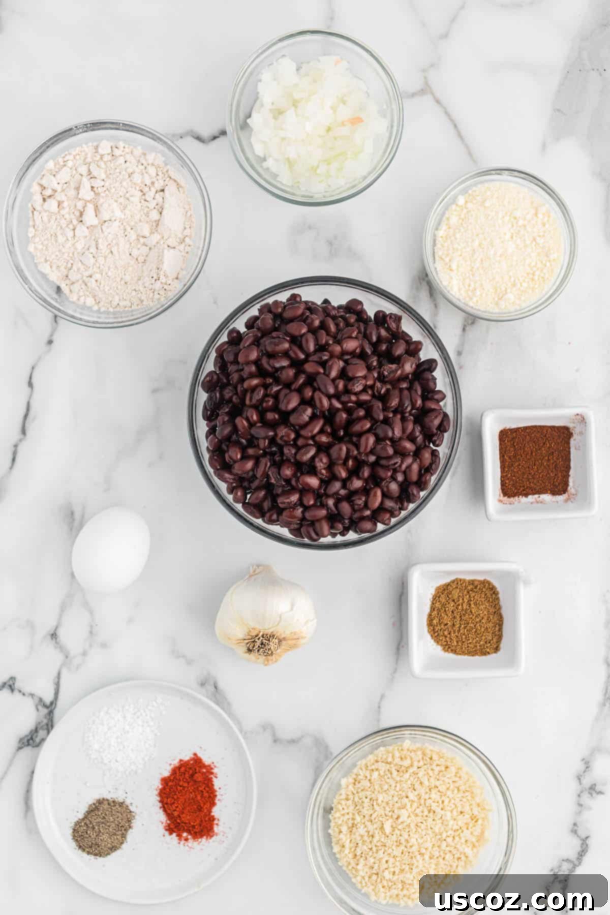 Ultimate Black Bean Burgers 3 a delightful array of fresh ingredients including black beans, onion, garlic, and spices, ready to be transformed into homemade black bean burgers