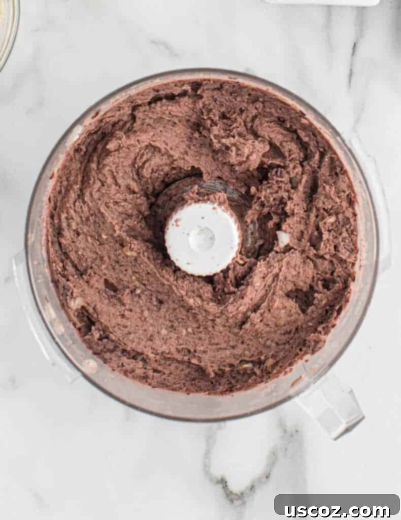 Ultimate Black Bean Burgers 5 smooth, blended homemade black bean burger batter in a food processor after processing
