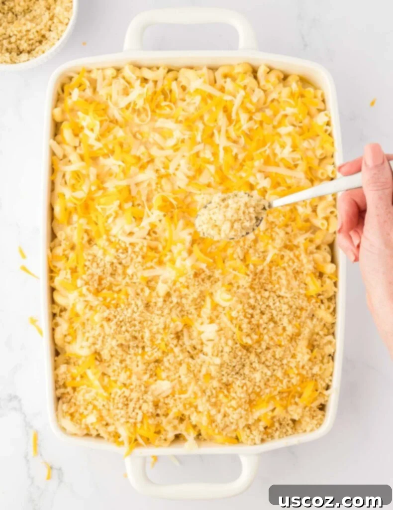 Golden Baked Macaroni Perfection 16 adding the bread crumb topping to the mac and cheese