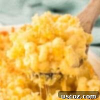 Golden Baked Macaroni Perfection 24 scooping mac and cheese from the baking dish