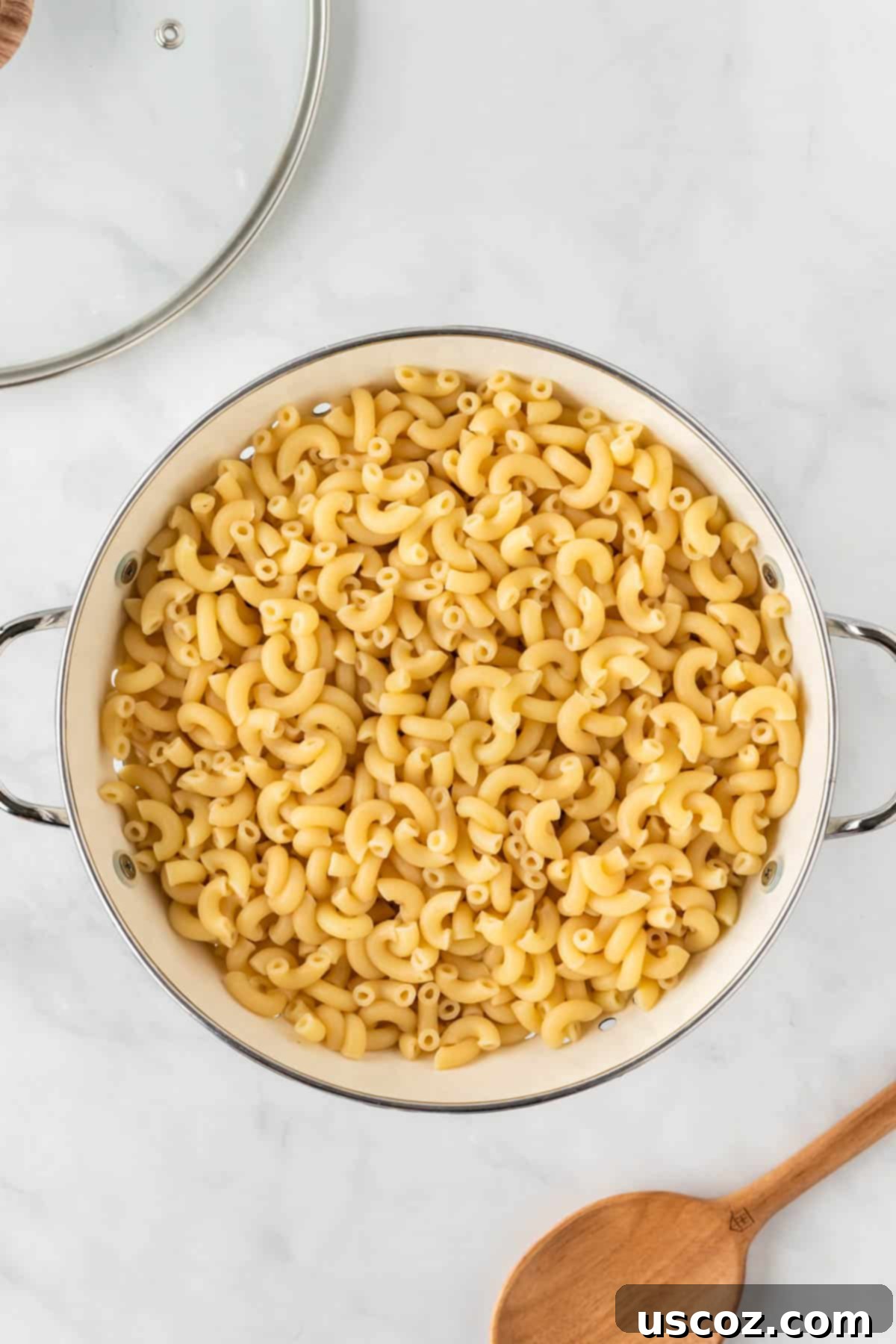 Golden Baked Macaroni Perfection 5 cooked macaroni noodles in a strainer