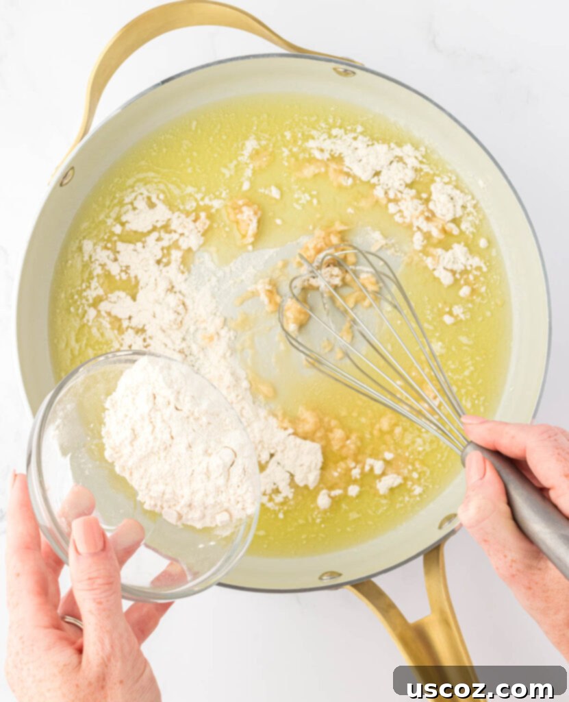 Golden Baked Macaroni Perfection 7 whisking flour into melted butter for roux
