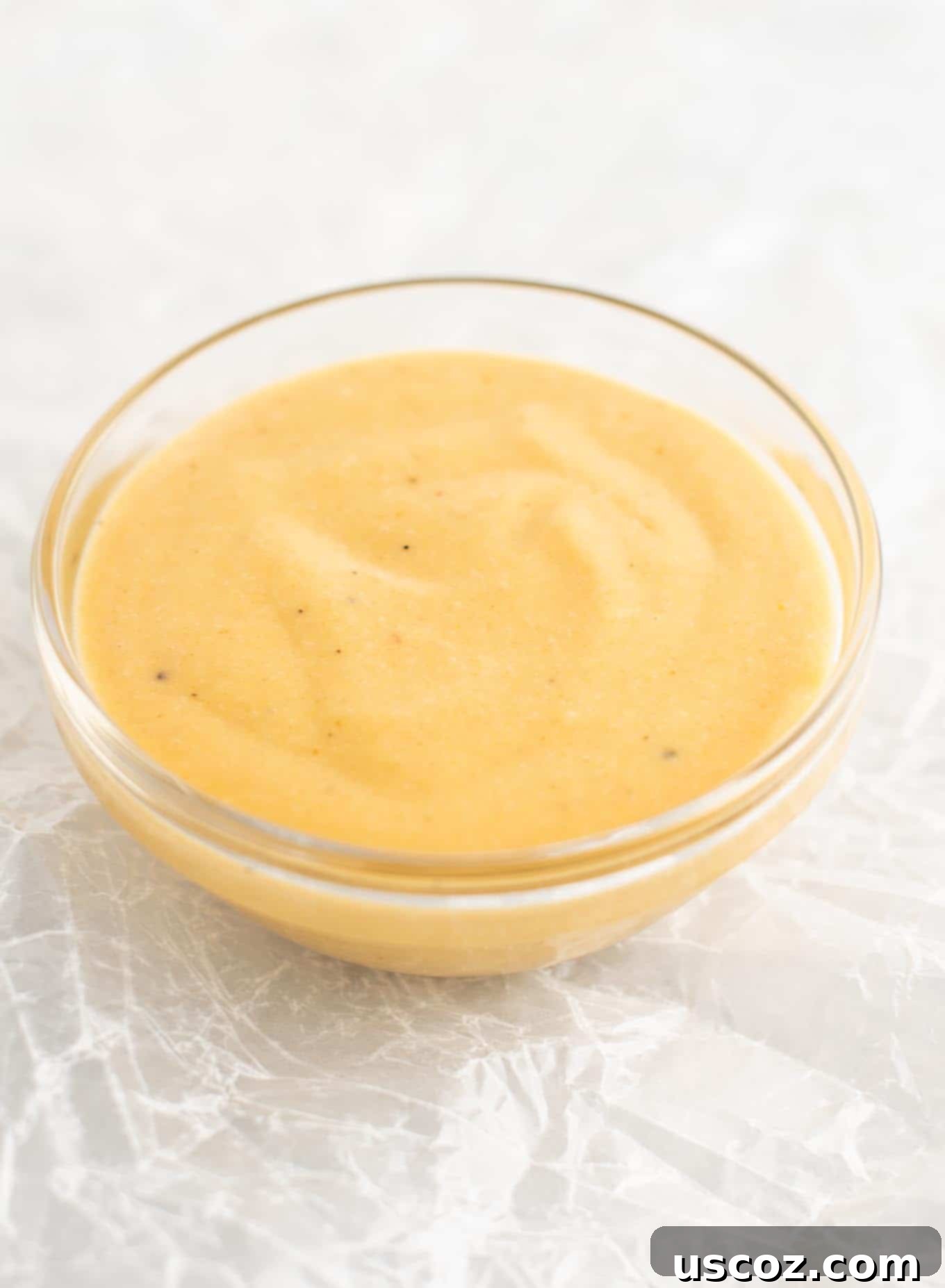 Golden Chickpea Poppers 3 A bowl of creamy, yellow Chick-fil-A style dipping sauce, perfect for chickpea nuggets.