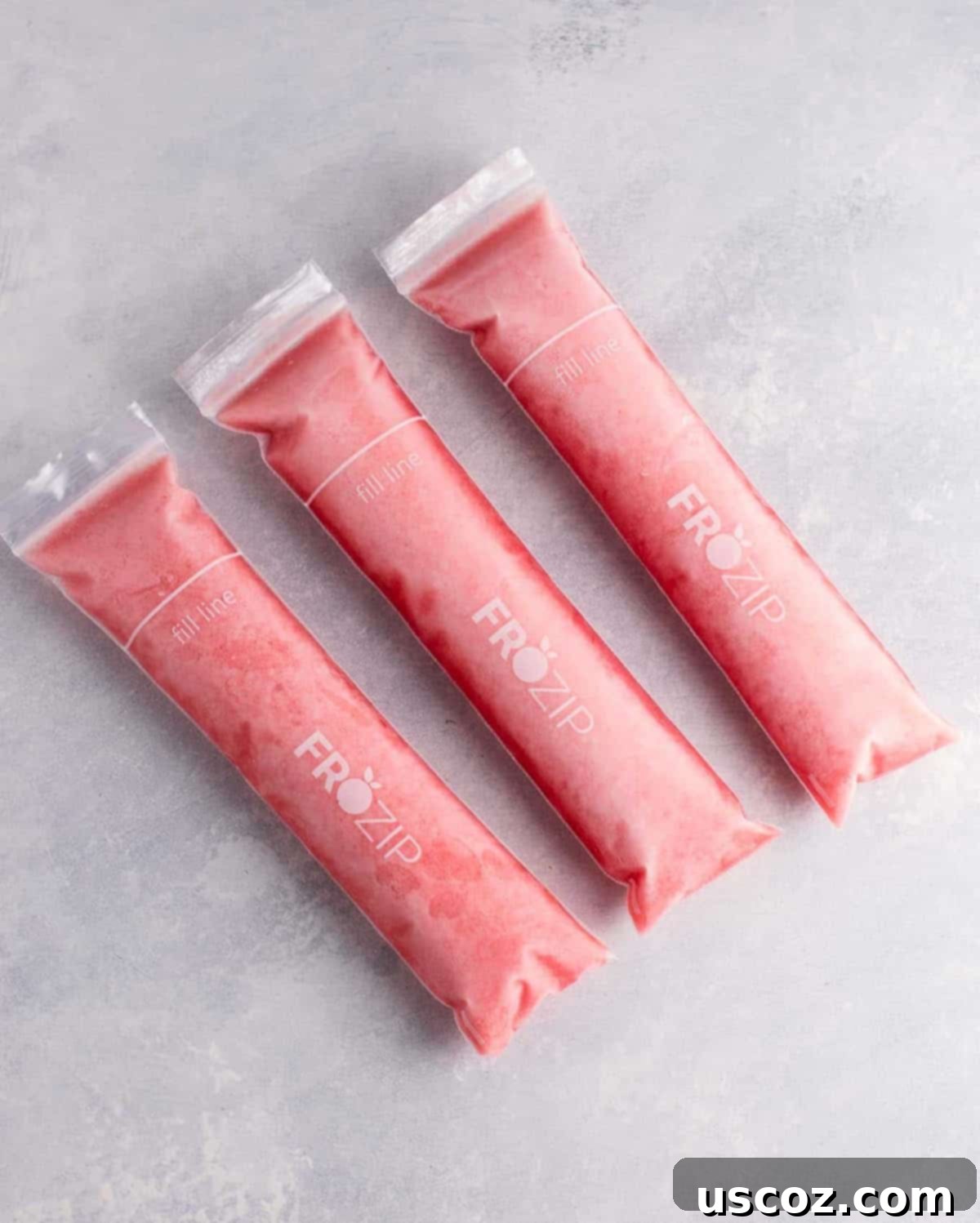 Delicious Strawberry Pineapple Freezer Pops made with frozen fruit, coconut water, and pure maple syrup – a healthy and refreshing summer dessert idea.