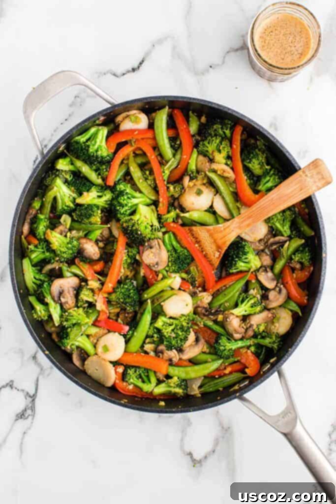 Quick Vegetable Stir Fry 9 wooden spoon stirring vegetable stir fry