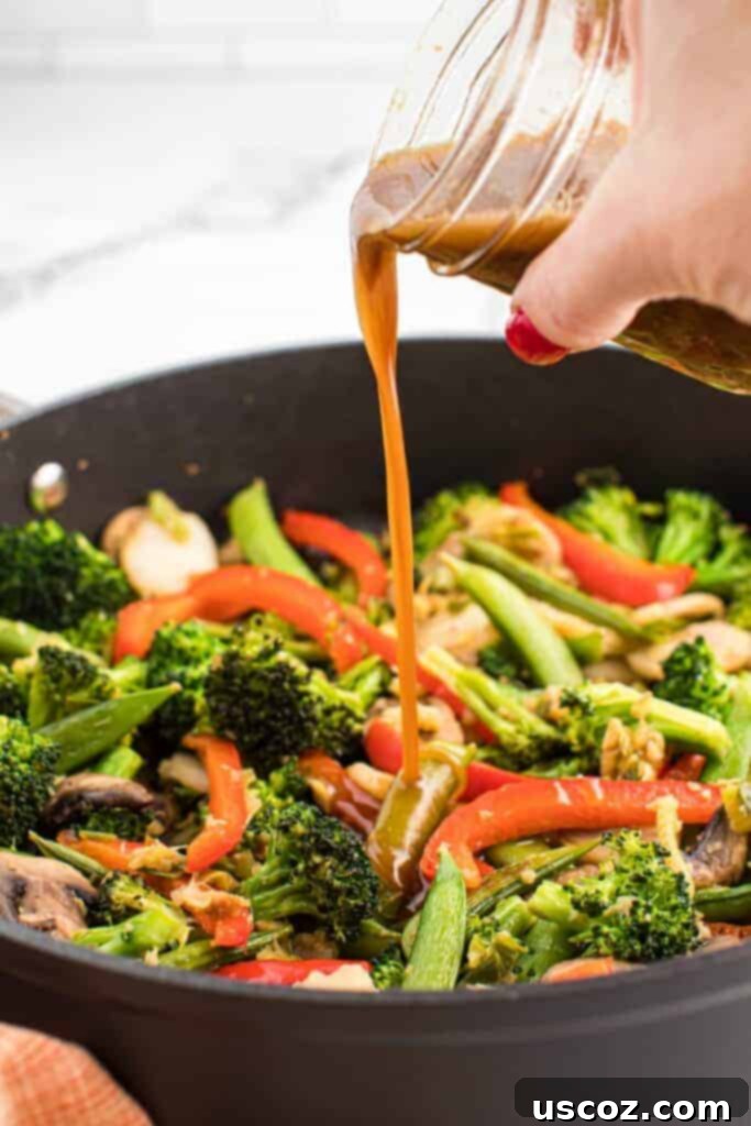 Quick Vegetable Stir Fry 10 pouring stir fry sauce over vegetables