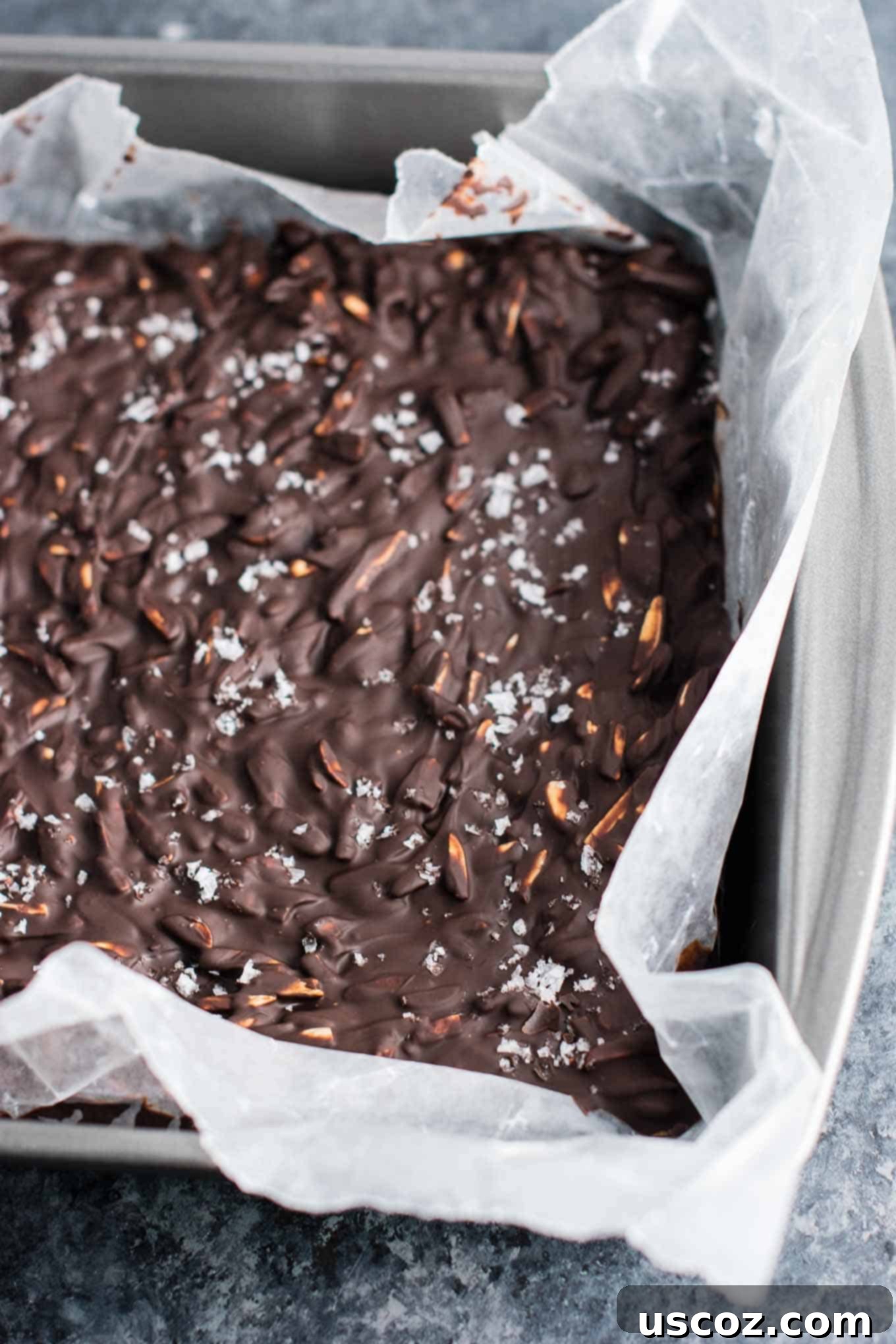 25 Decadent Gluten-Free Dairy-Free Desserts 25 Close-up of dark chocolate almond bark studded with slivered almonds and flaky sea salt, broken into irresistible pieces.