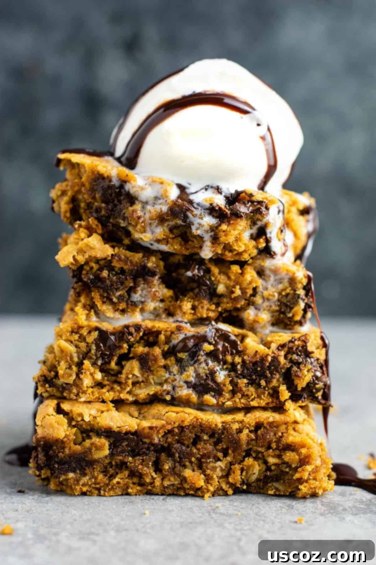25 Decadent Gluten-Free Dairy-Free Desserts 5 Deliciously thick and chewy gluten-free oatmeal chocolate chip cookie bars cut into squares.