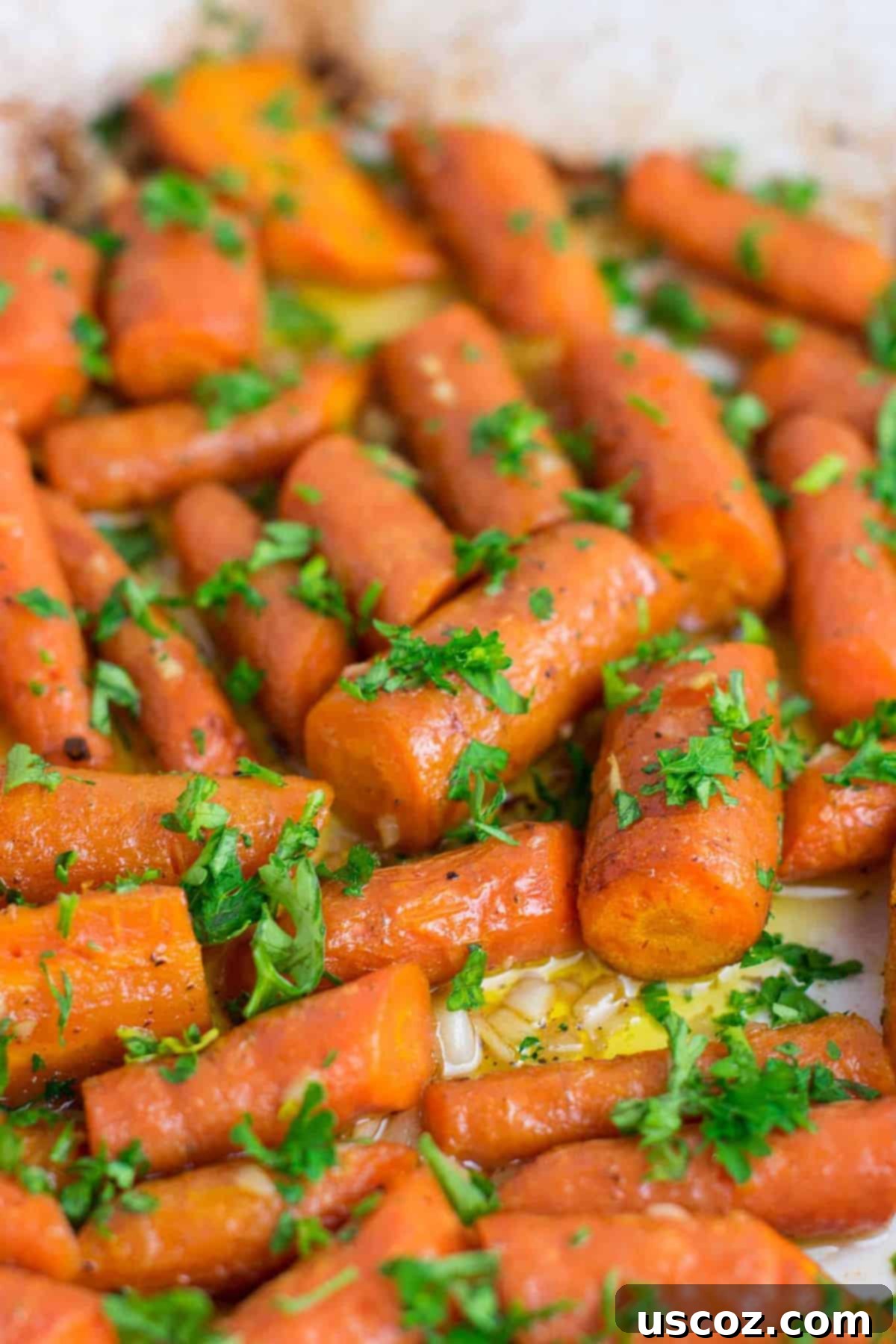 Unlock 29 Delicious Vegan Dinners 25 Garlic butter roasted carrots recipe with fresh parsley, a delicious vegan-friendly side dish.
