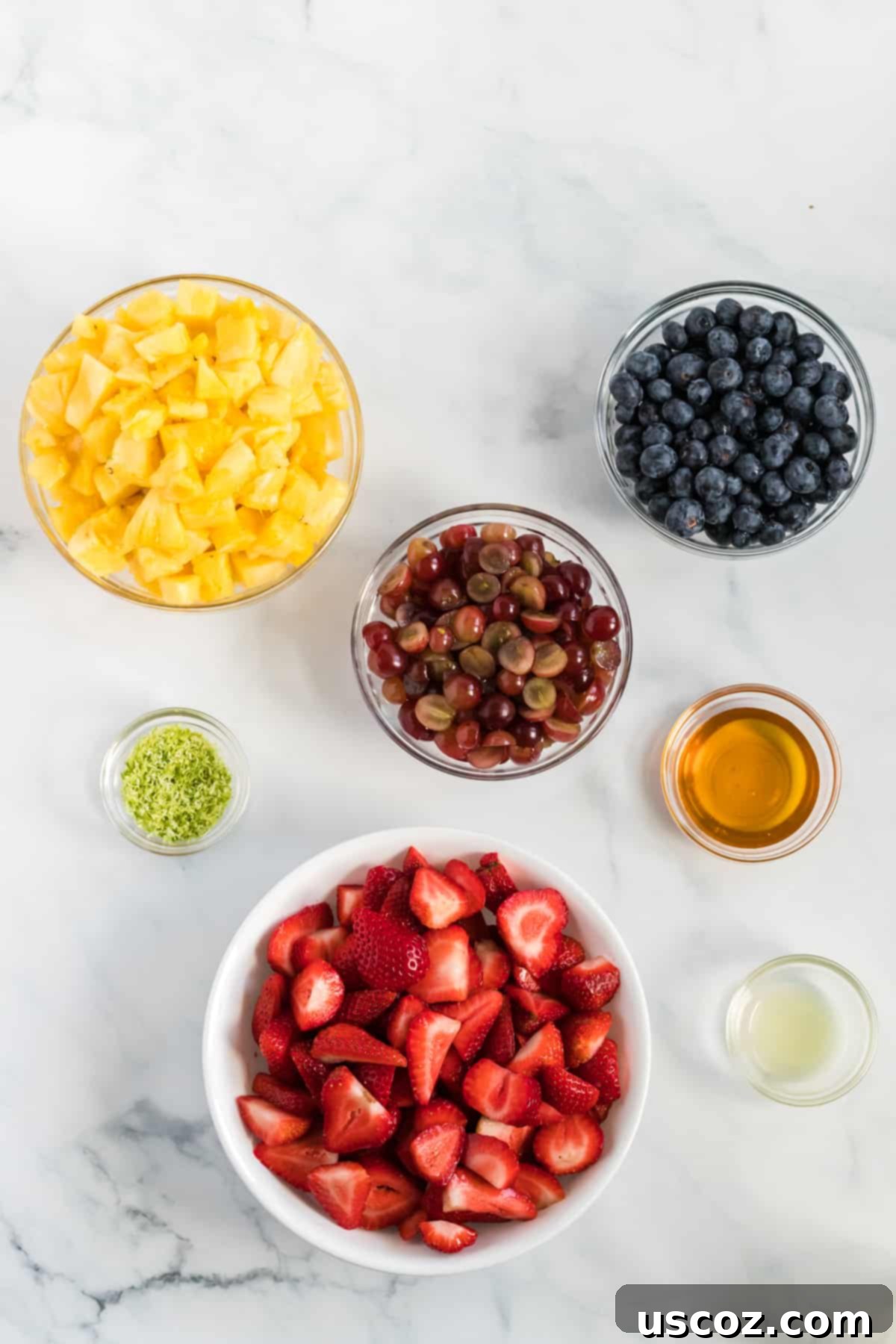 Vibrant Fruit Medley 4 fruit salad ingredients in separate glass bowls