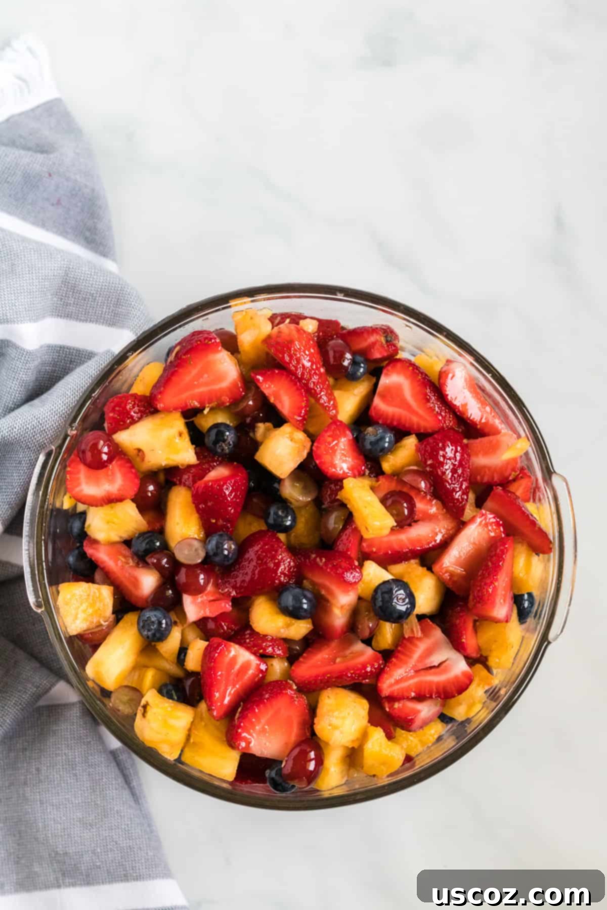 Vibrant Fruit Medley 7 simple fruit salad recipe with honey lime dressing in a glass bowl