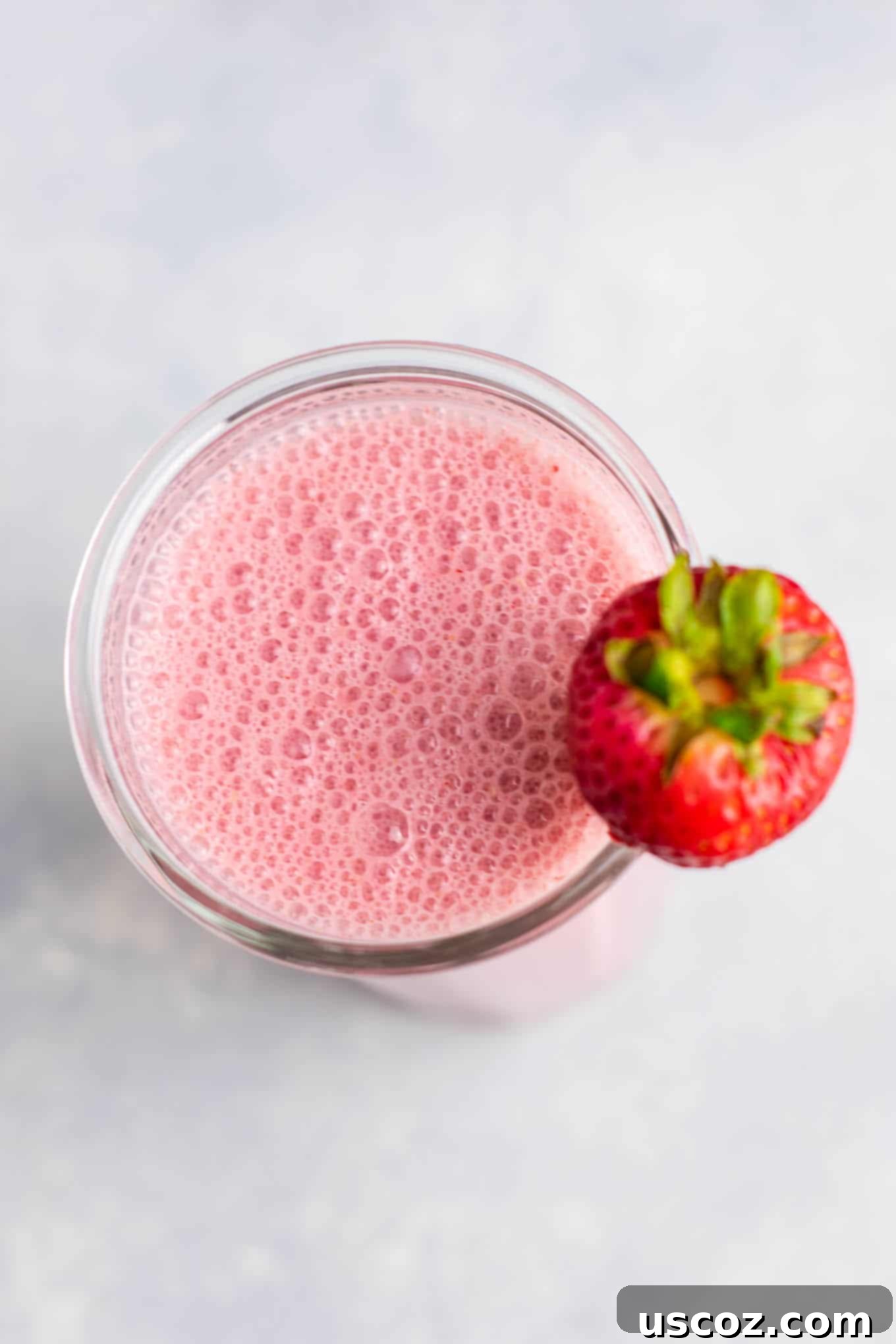 Easy strawberry smoothie recipe with fresh strawberries and simple healthy ingredients. A perfect and refreshing drink for any time of year, whether for breakfast or a healthy snack.
