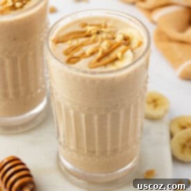 Peanut Butter Banana Dream 8 peanut butter banana smoothie topped with drizzled peanut butter and peanuts