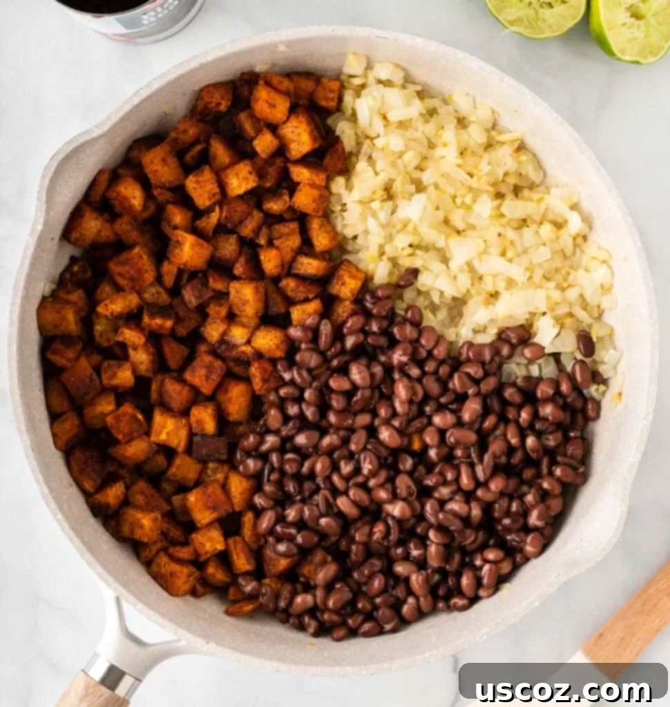 Sweet Potato Fiesta 12 sweet potatoes, black beans, and garlic and onion in a skillet
