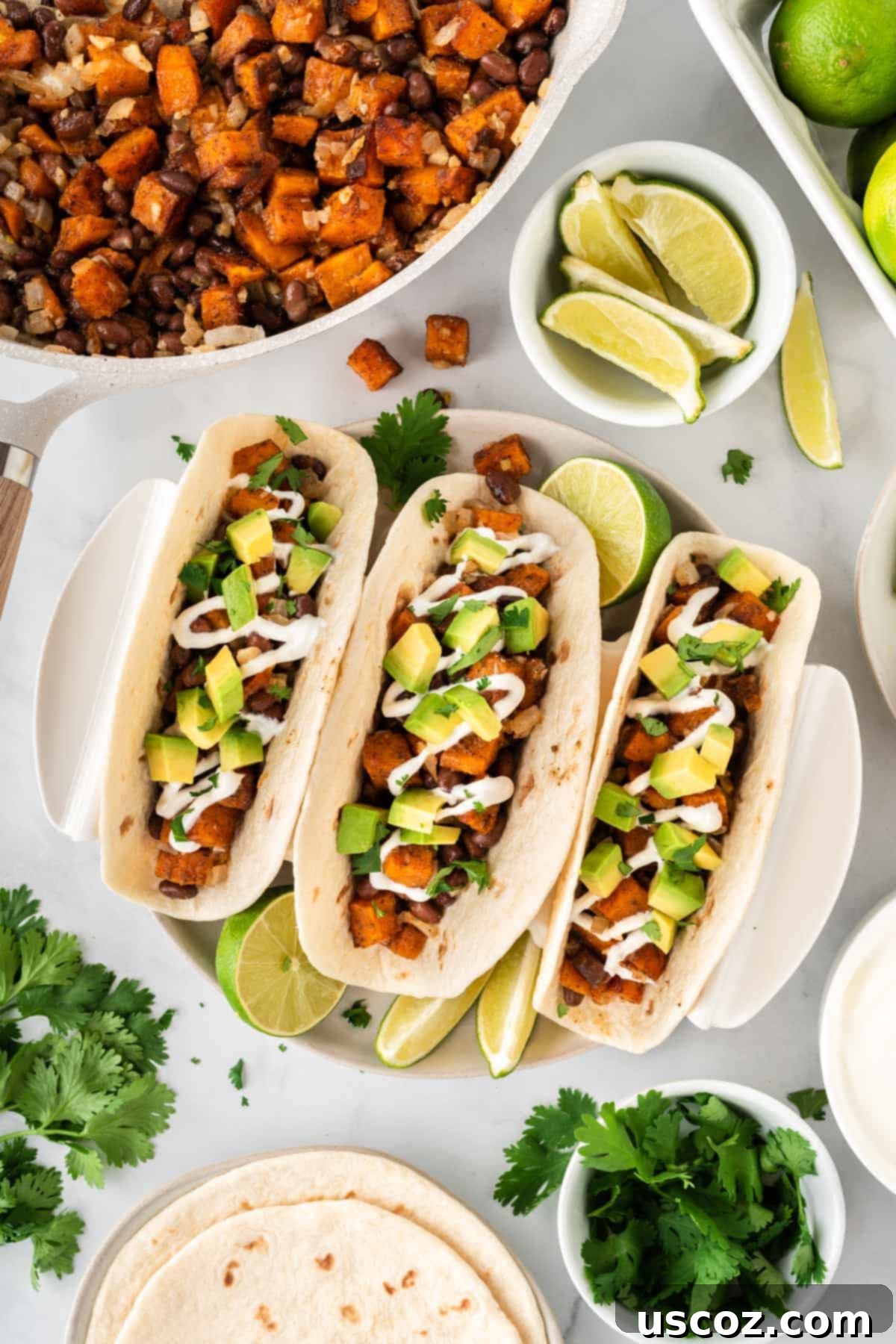 Sweet Potato Fiesta 3 sweet potato tacos topped with sour cream and diced avocado