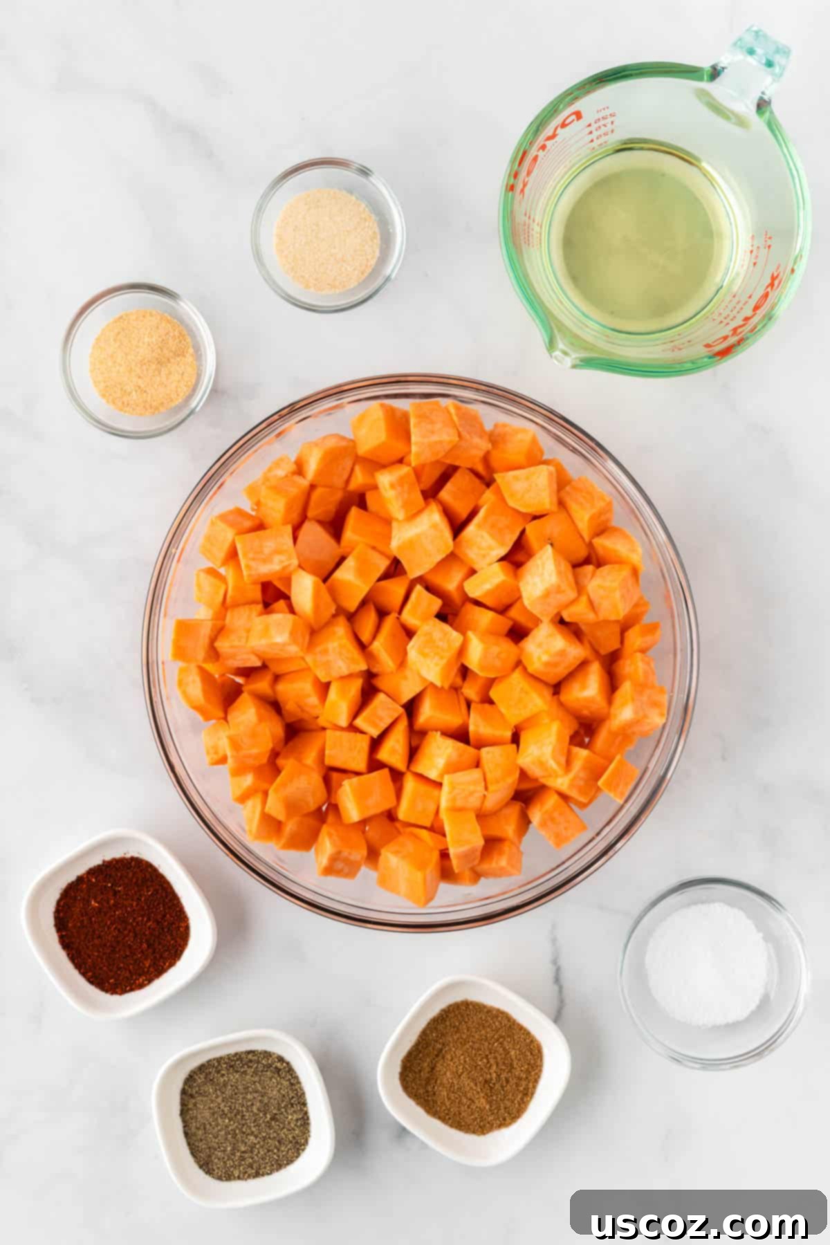 Sweet Potato Fiesta 6 diced sweet potatoes in a bowl surrounded by oil and spices