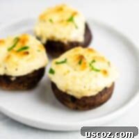 Hearty Stuffed Portobello Delights 12 Easy Stuffed Portobello mushrooms with cream cheese and sour cream – a healthy vegetarian appetizer! (and low carb) #easyrecipe #creamcheese #vegetarian #appetizer #vegetarianappetizer #lowcarb #healthy #healthyrecipe #healthyappetizer