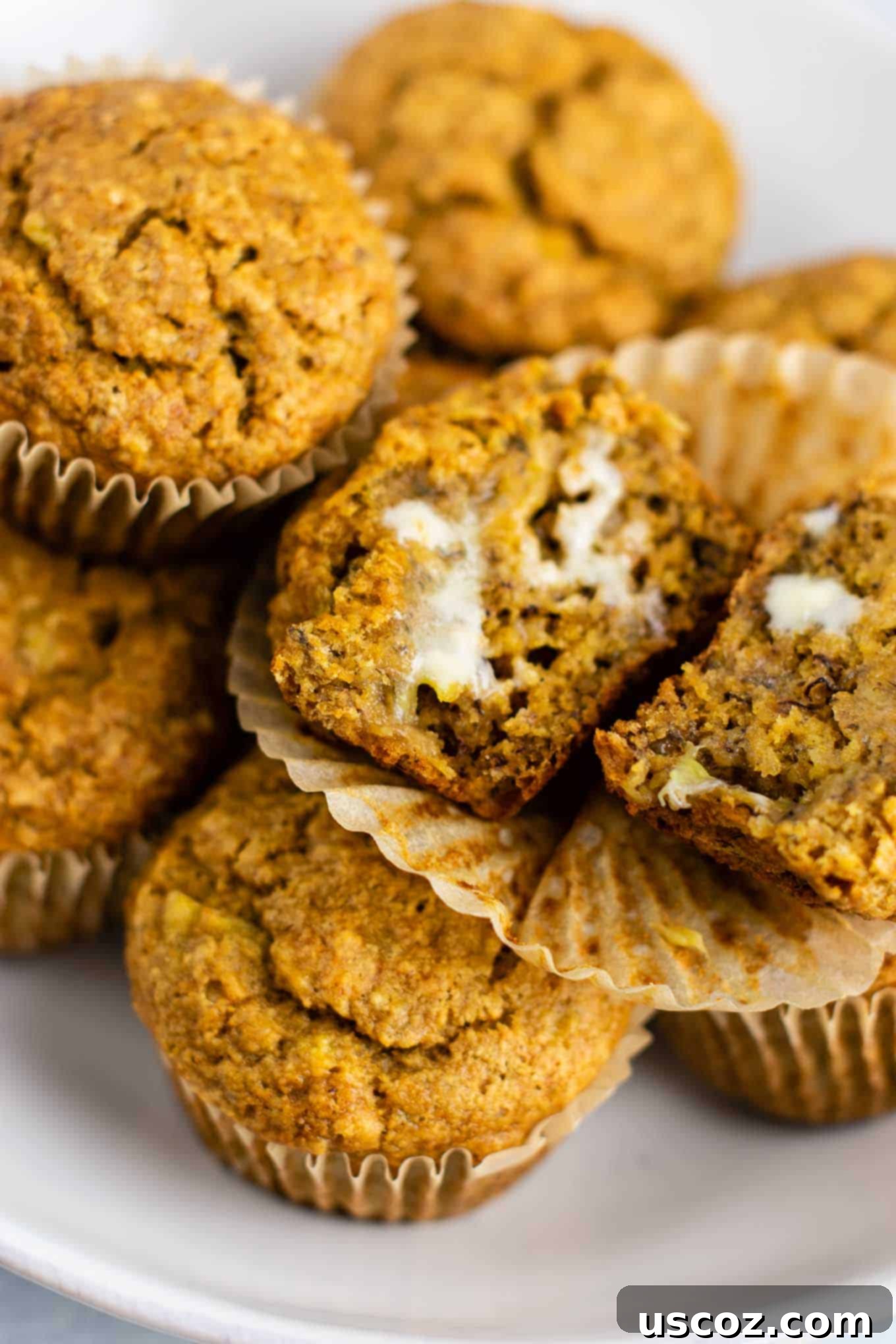 Moist Vegan Banana Muffins 5 a vegan banana muffin with vegan butter spread on top, ready to eat