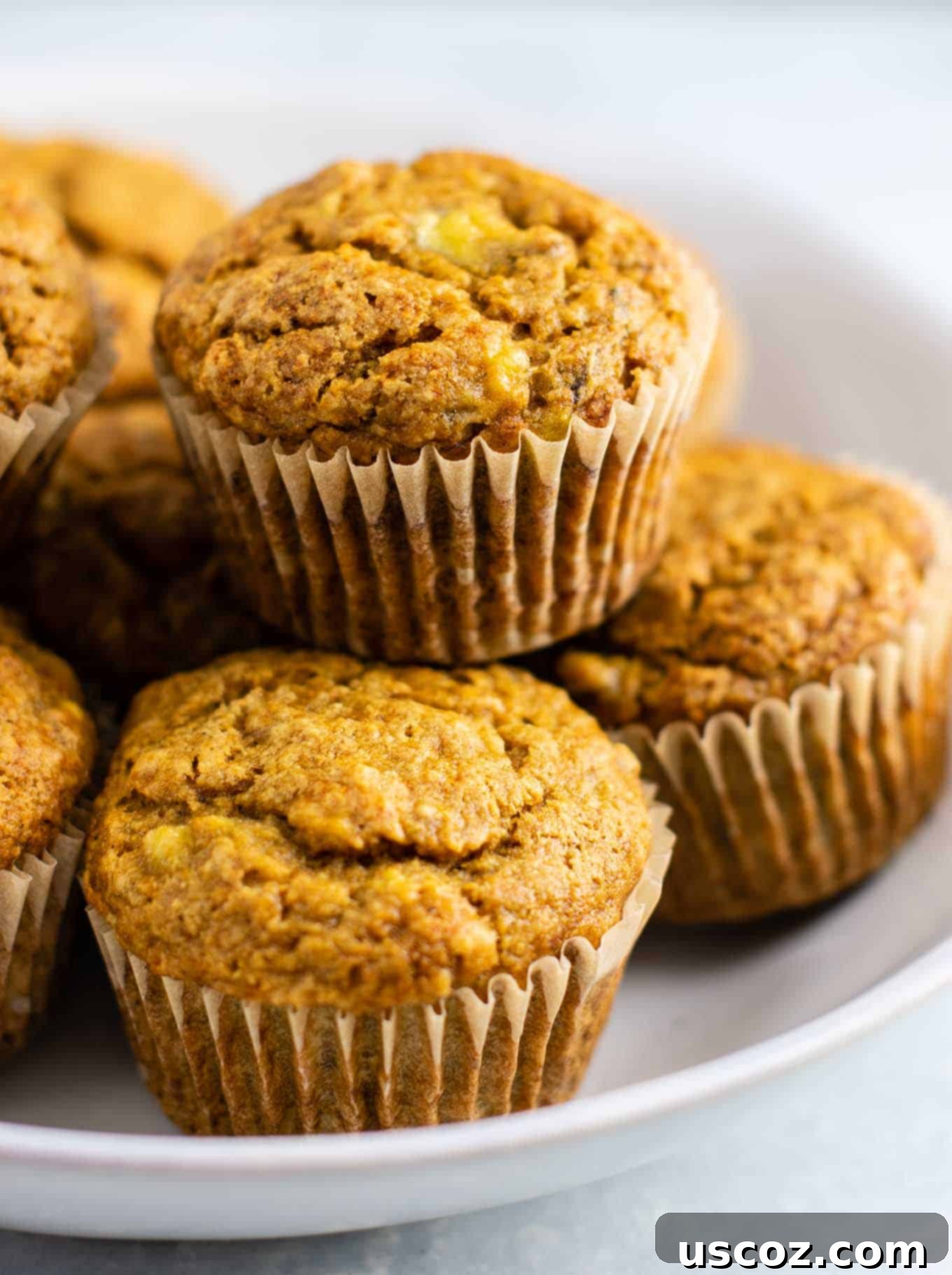 Moist Vegan Banana Muffins 7 delicious vegan muffins with mashed banana, showing their fluffy interior