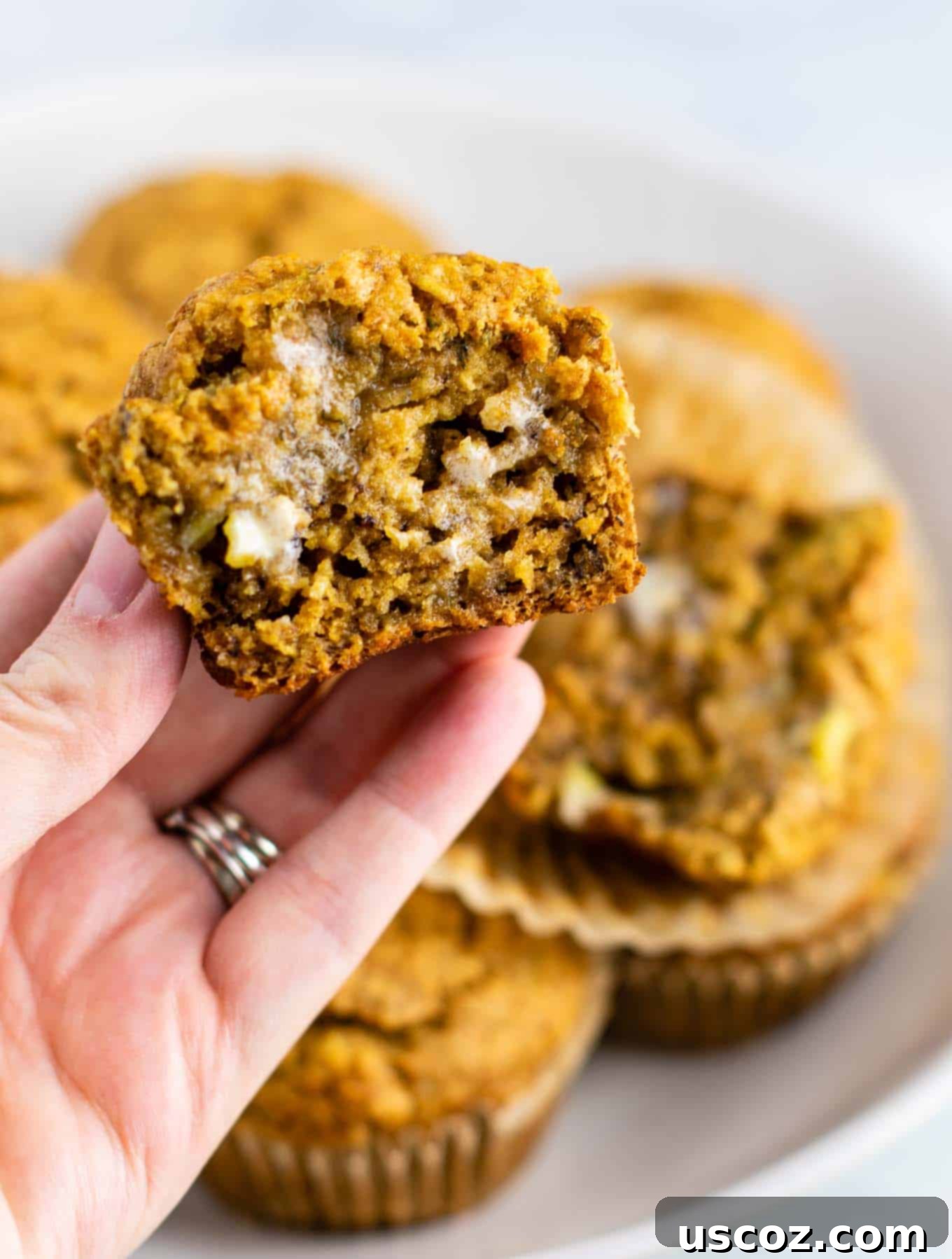 Moist Vegan Banana Muffins 9 a freshly baked vegan muffin recipe, stacked on a plate