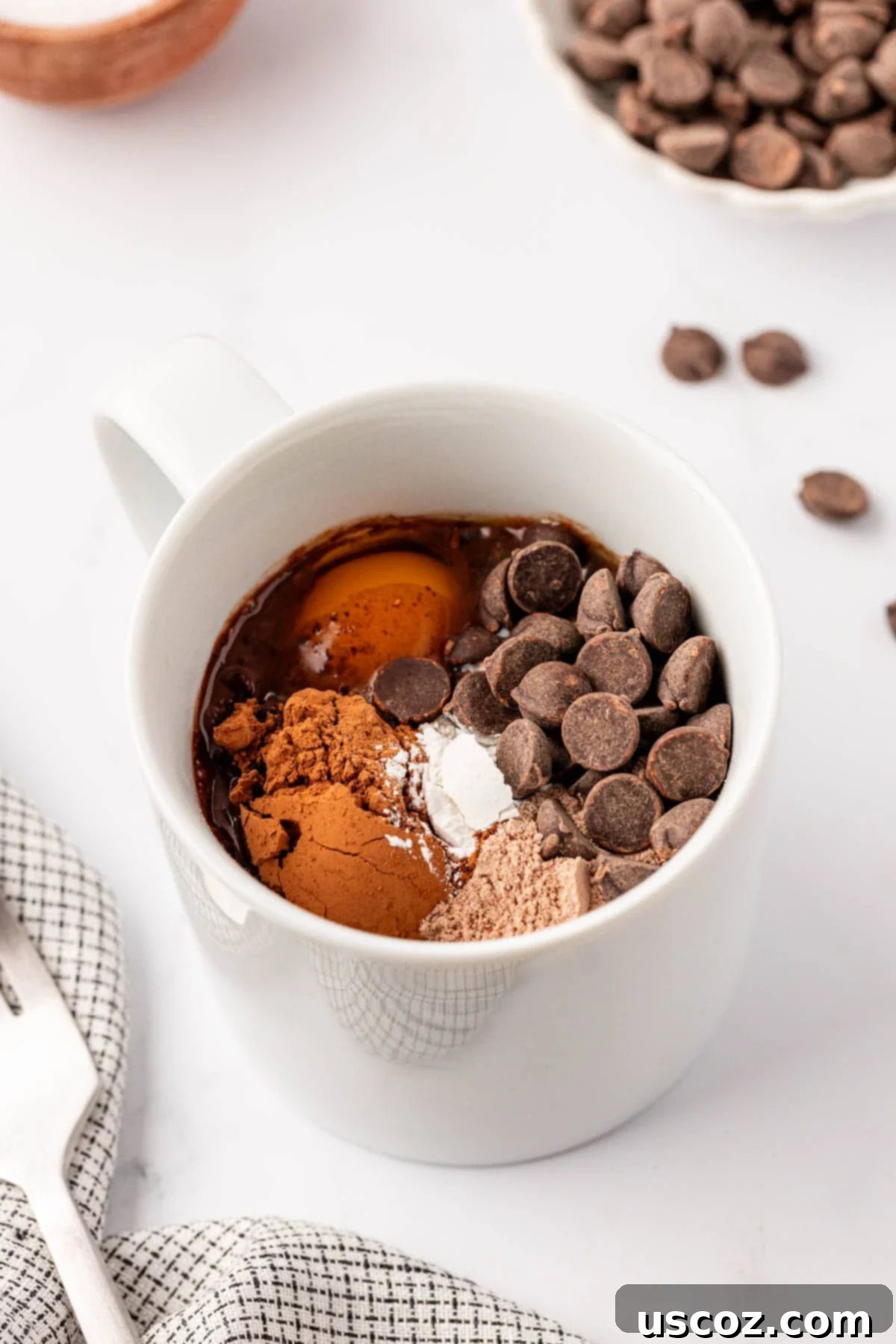 High Protein Chocolate Mug Cake 5 protein mug cake ingredients in a white mug