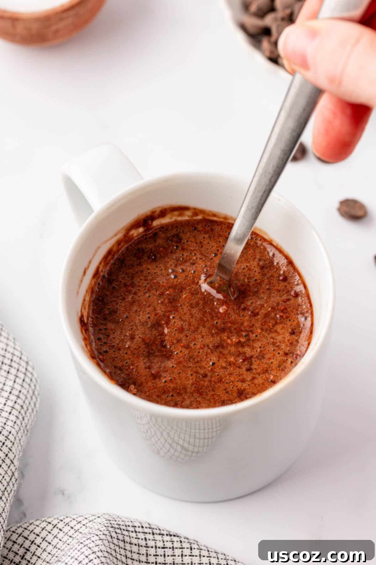 High Protein Chocolate Mug Cake 6 stirring the mug cake ingredients together