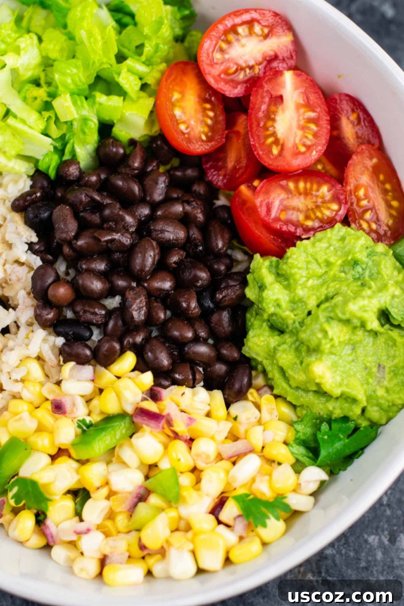 Ultimate Vegan Burrito Bowl 3 Vegan burrito bowl recipe with homemade fresh corn salsa and guacamole. Better than chipotle and so fresh and delicious! #vegan #burritobowl #meatless #chipotle #mexican #dinner #vegetarian #mealprep #dairyfree #guacamole #cornsalsa