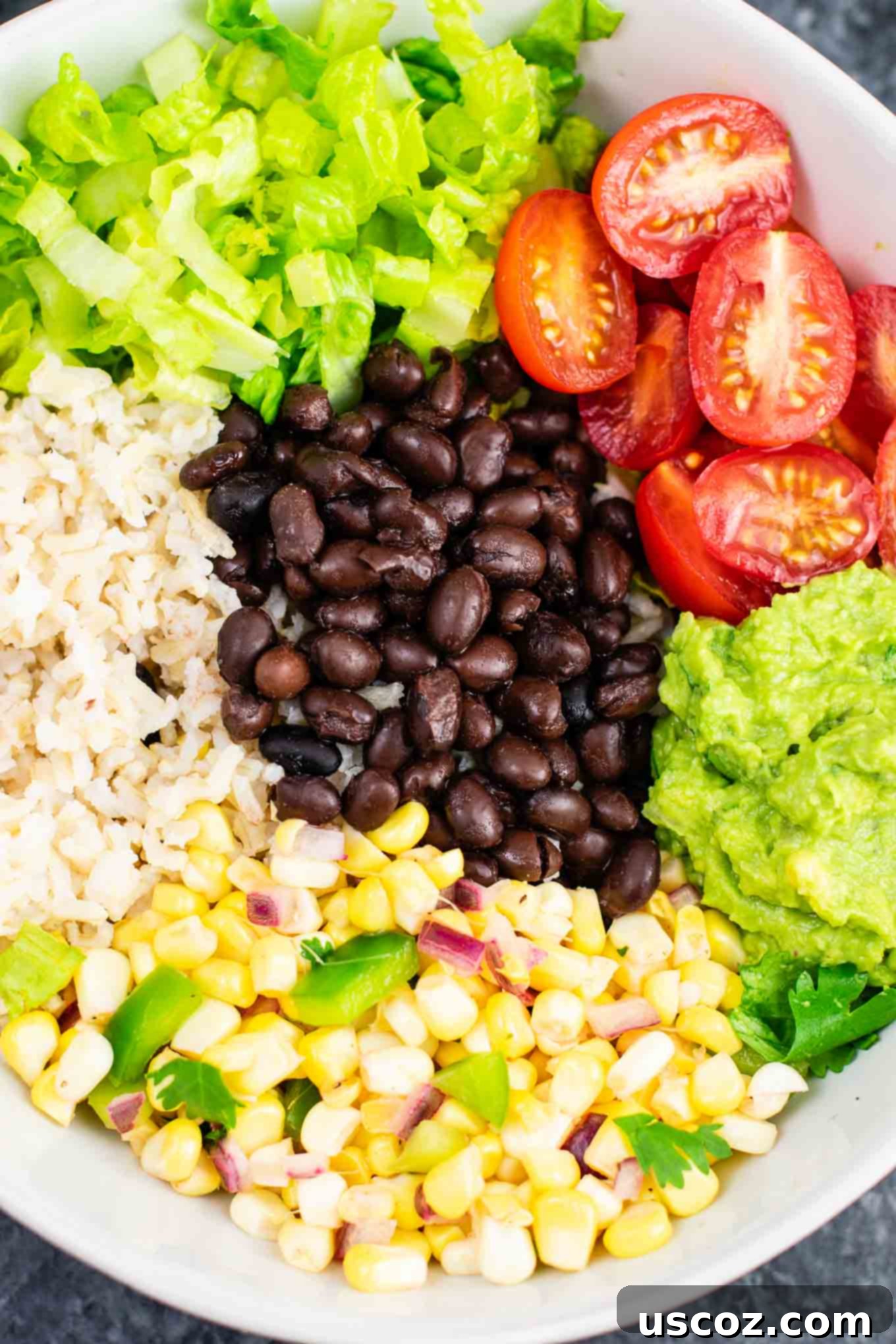 Ultimate Vegan Burrito Bowl 7 Vegan burrito bowl recipe with homemade fresh corn salsa and guacamole. Better than chipotle and so fresh and delicious! #vegan #burritobowl #meatless #chipotle #mexican #dinner #vegetarian #mealprep #dairyfree #guacamole #cornsalsa