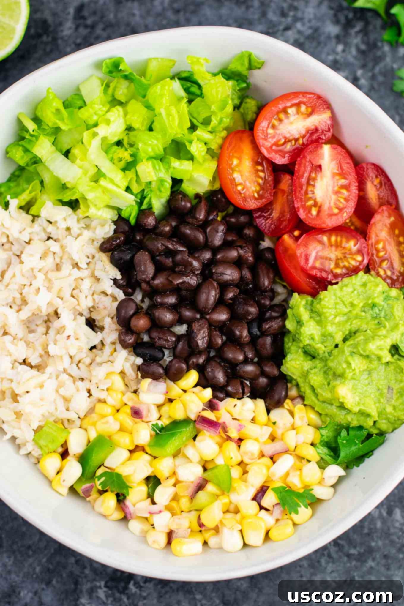 Ultimate Vegan Burrito Bowl 8 Vegan burrito bowl recipe with homemade fresh corn salsa and guacamole. Better than chipotle and so fresh and delicious! #vegan #burritobowl #meatless #chipotle #mexican #dinner #vegetarian #mealprep #dairyfree #guacamole #cornsalsa