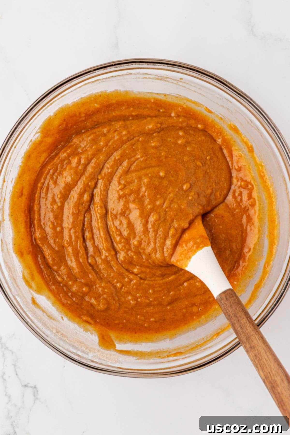 Pumpkin bread batter perfectly mixed, with no dry spots visible