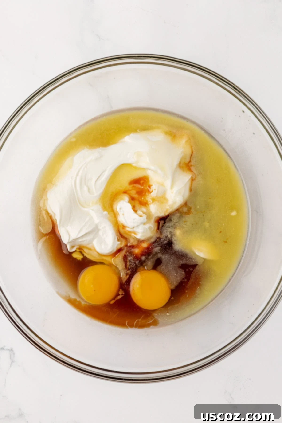 Wet ingredients for quick bread in a mixing bowl