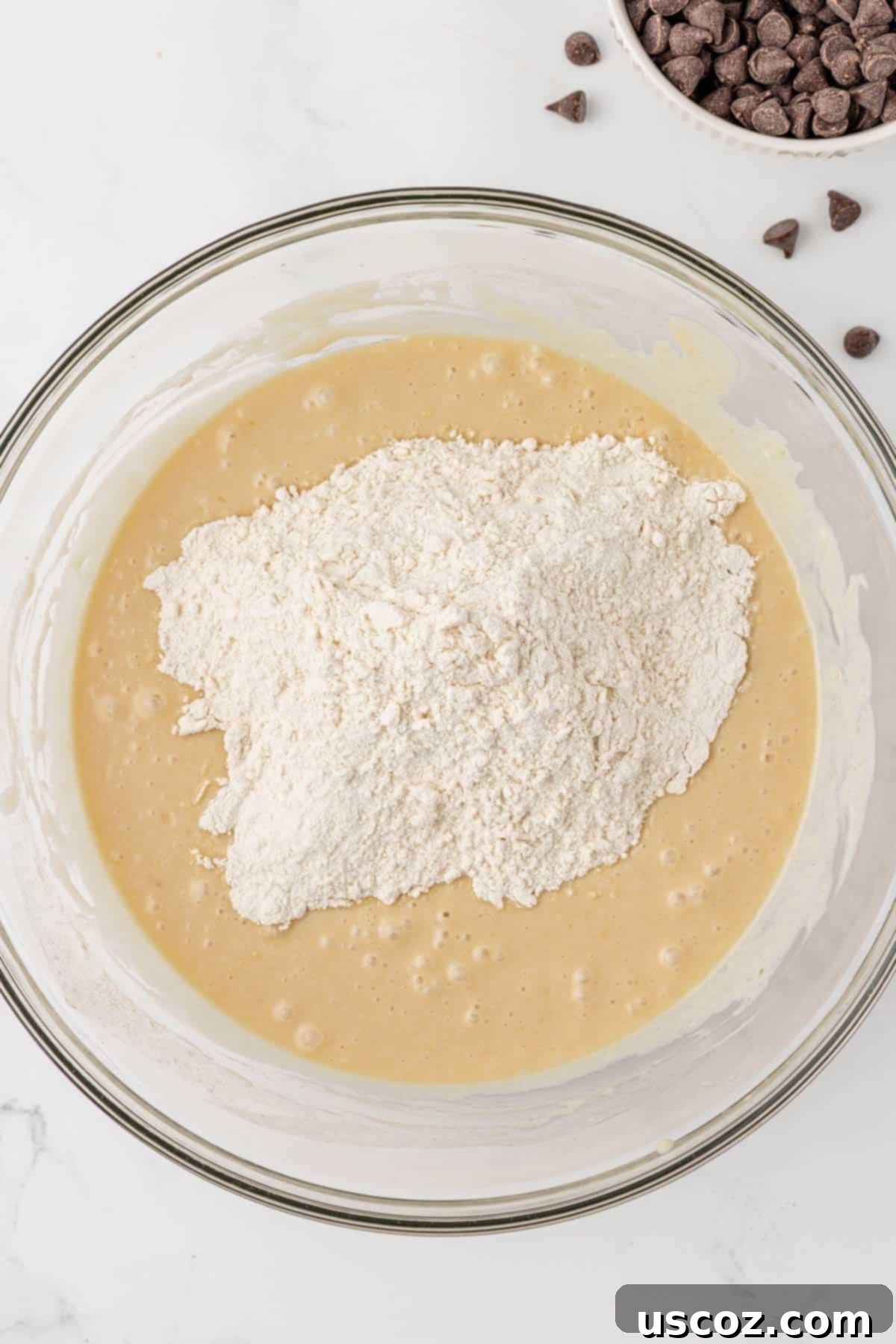 Adding dry ingredients to wet ingredients for quick bread batter