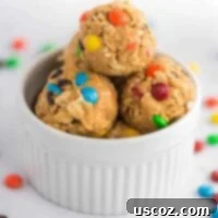 Monster cookie energy balls with colorful mini M&M's and oats visible on the sides