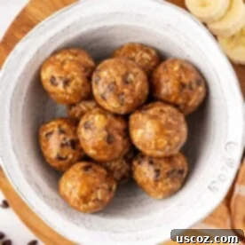 Moist-looking banana bread energy bites, possibly with walnuts or chocolate chips, arranged attractively