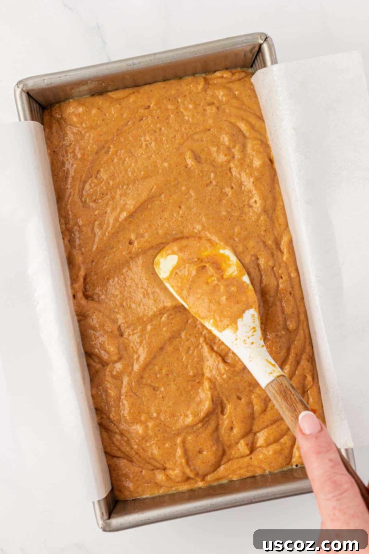 spreading the batter into the loaf pan