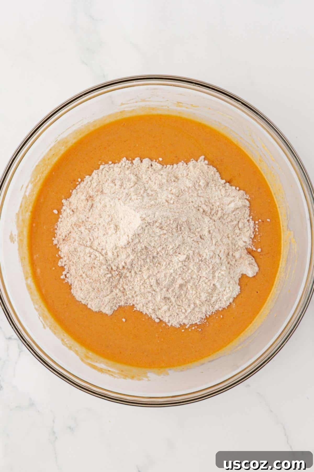 adding the dry ingredients to the wet ingredients