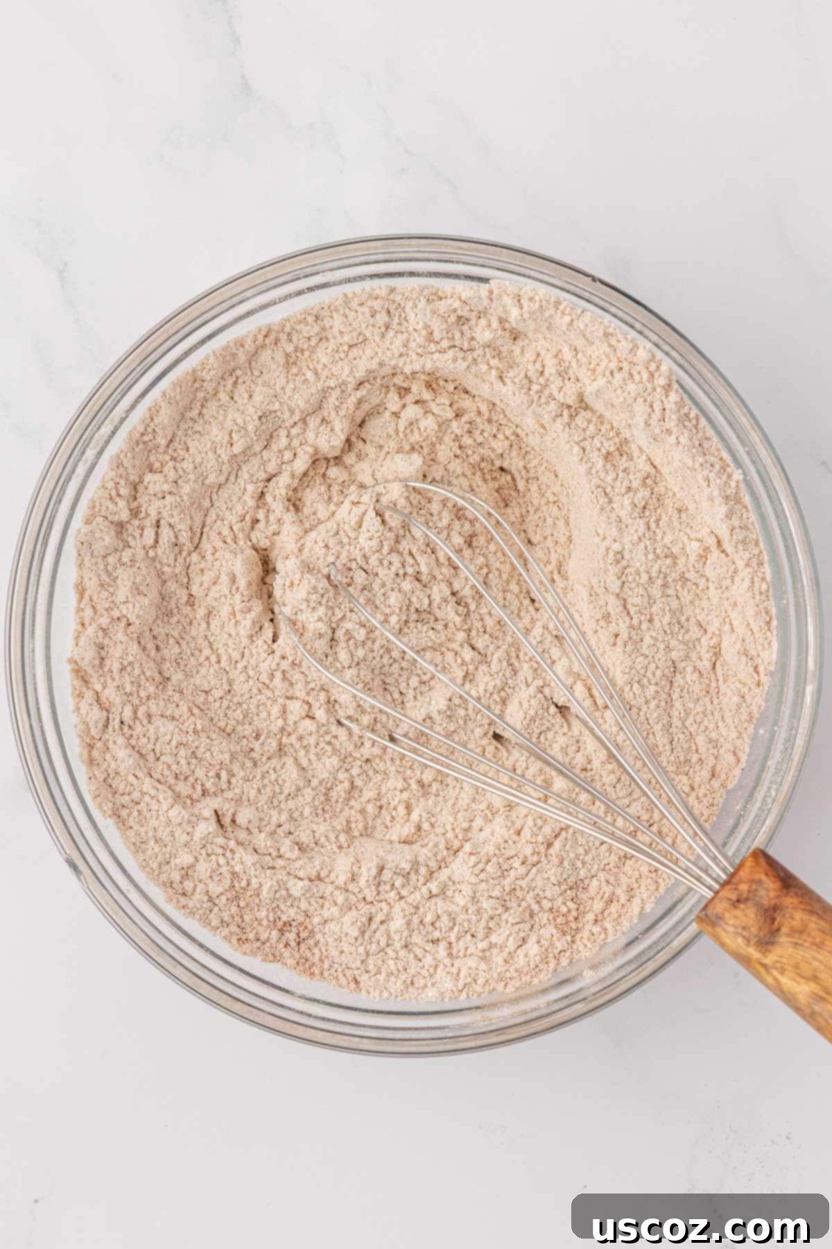 Whisked dry ingredients for pumpkin snack cake in a bowl